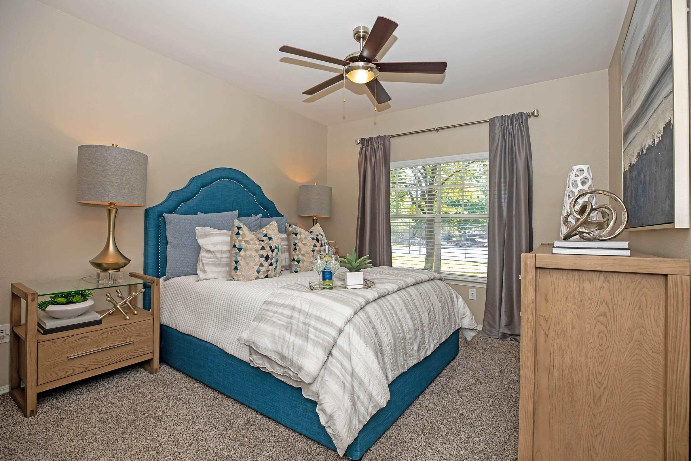 a furnished carpeted bedroom