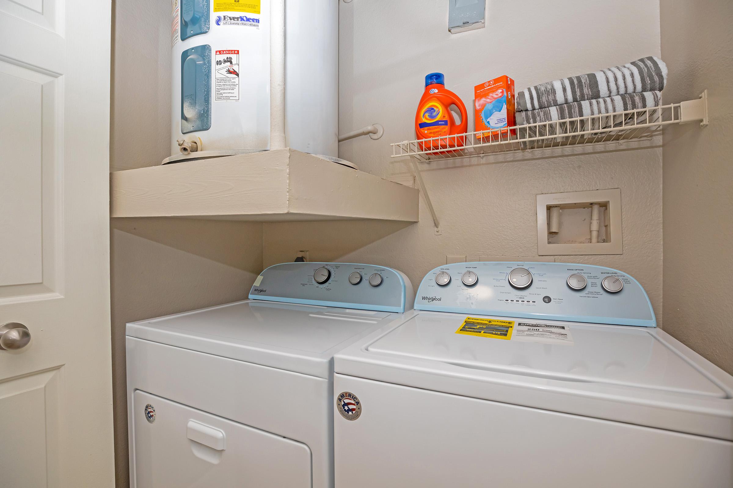 a furnished washer and drying in the laundry closet