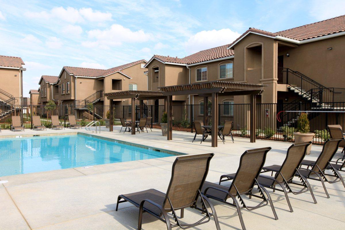 Soak in the sun on our pool deck at Greystone Apartments