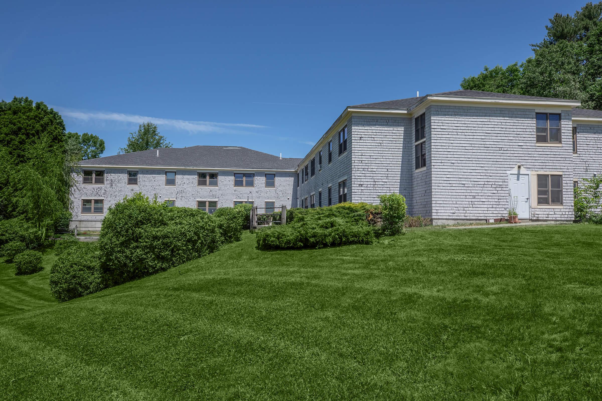 a large lawn in front of a house