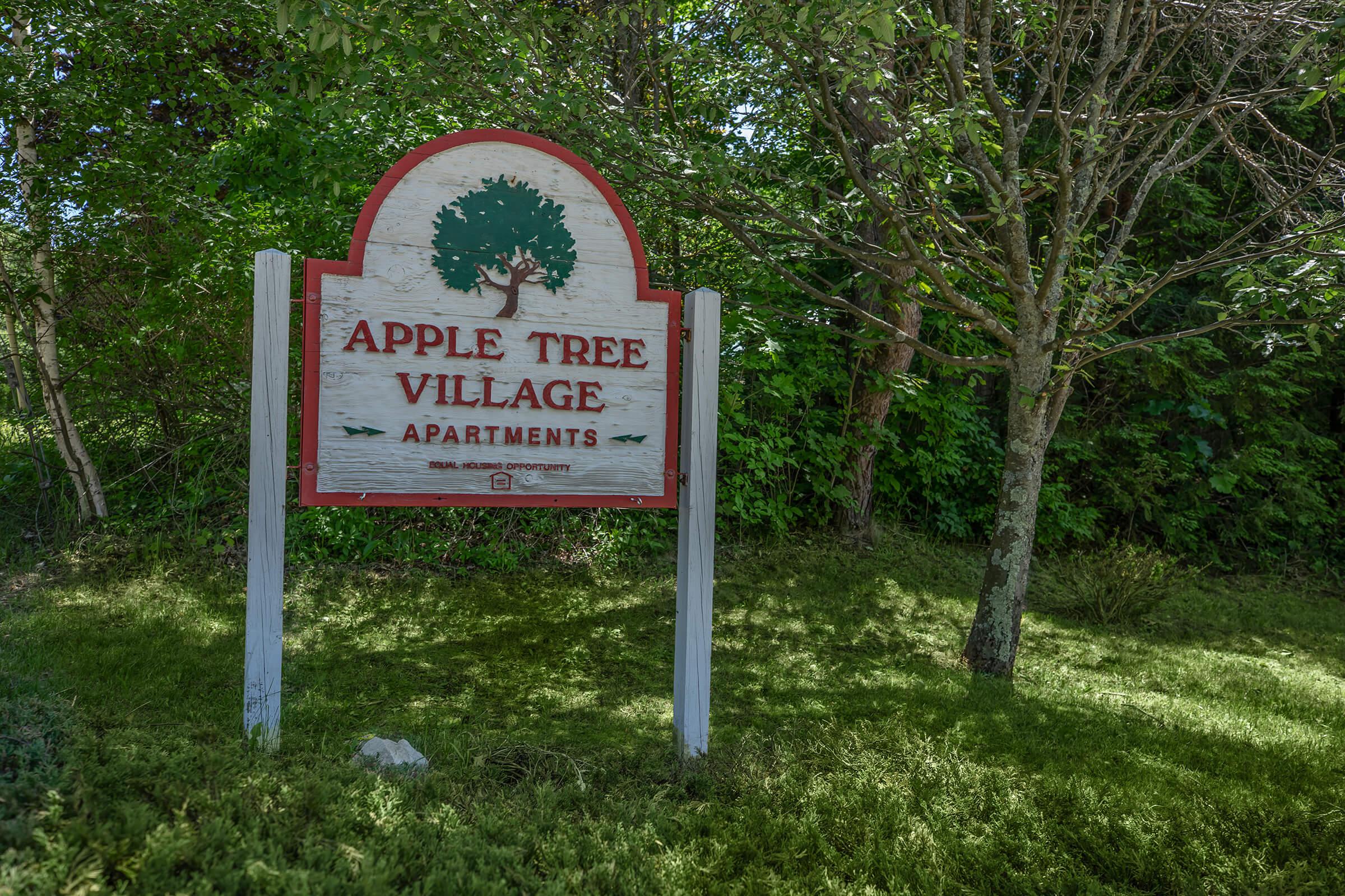 a sign sitting on the grass