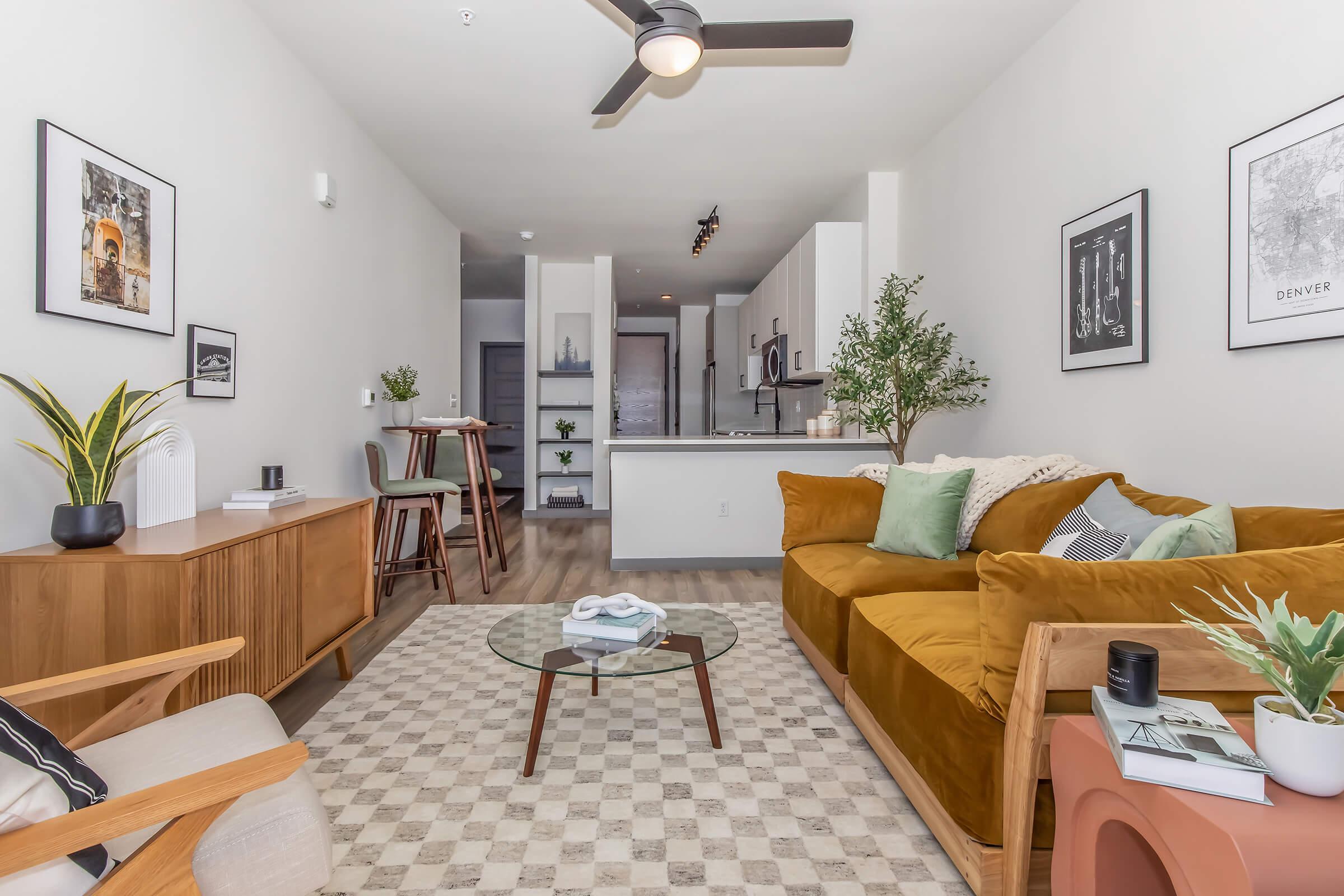 a living room filled with furniture and a fireplace