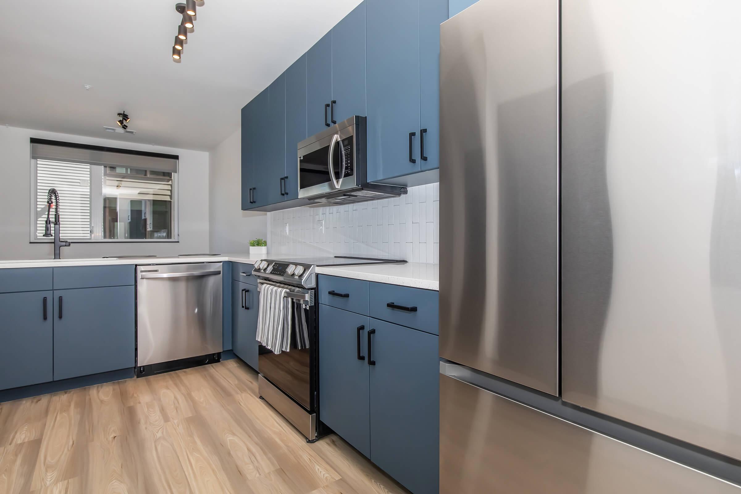 a stainless steel refrigerator in a kitchen