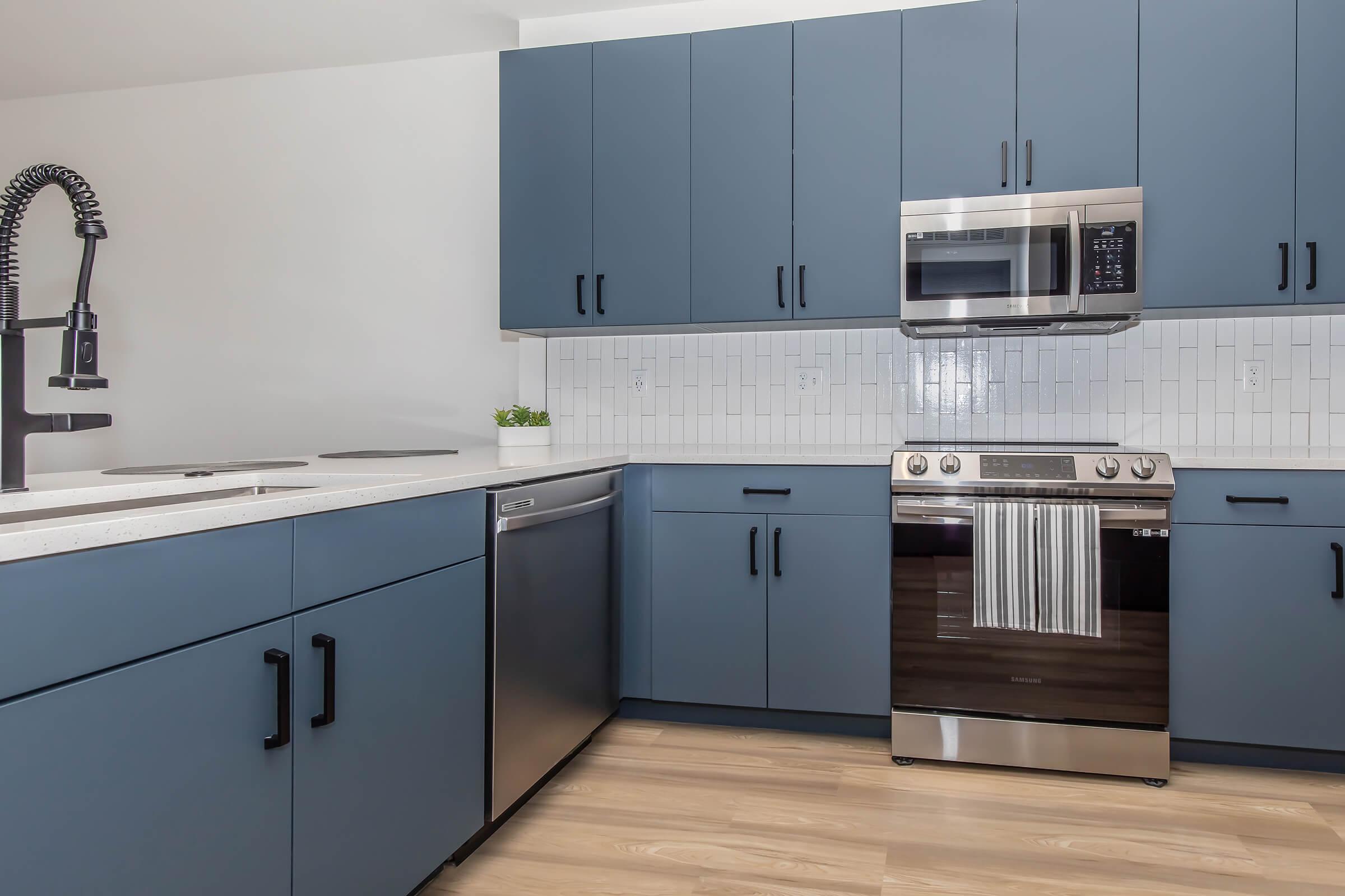 a kitchen with a stove and a sink