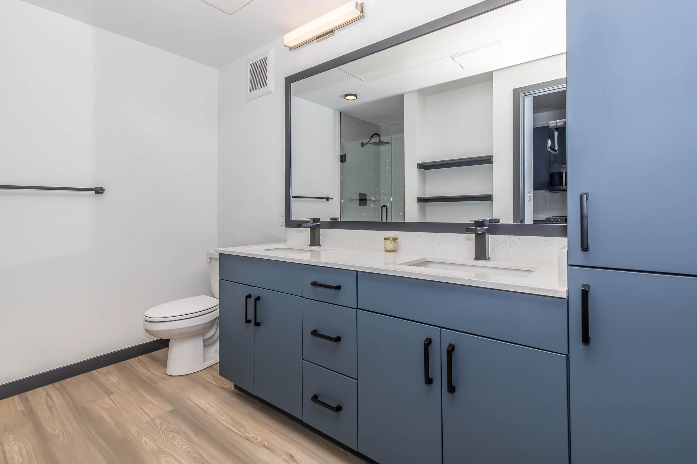 a kitchen with a sink and a mirror