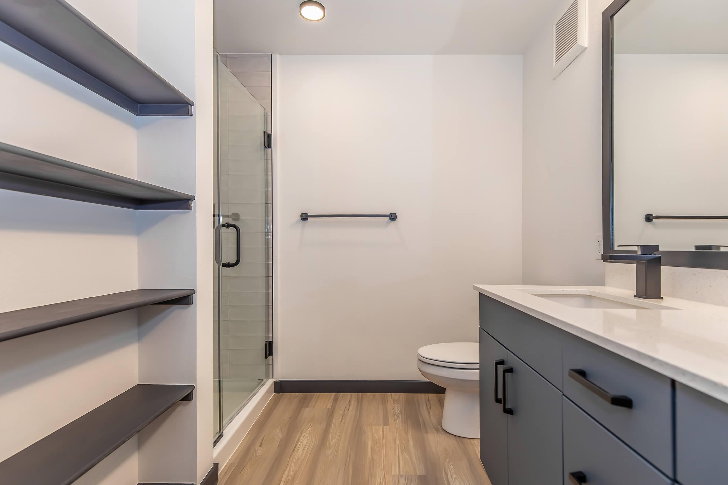 a kitchen with a sink and a mirror