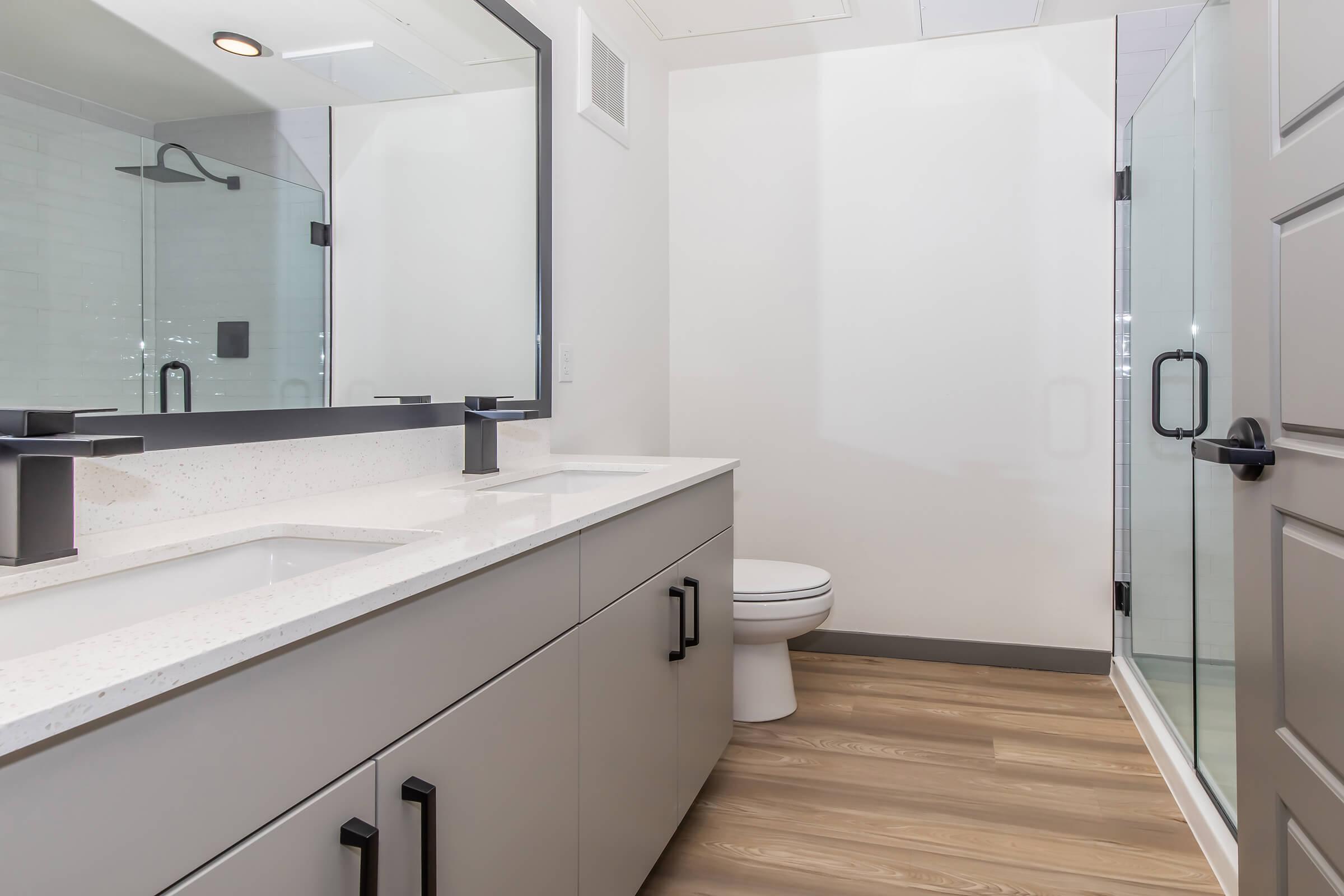 a kitchen with a sink and a mirror