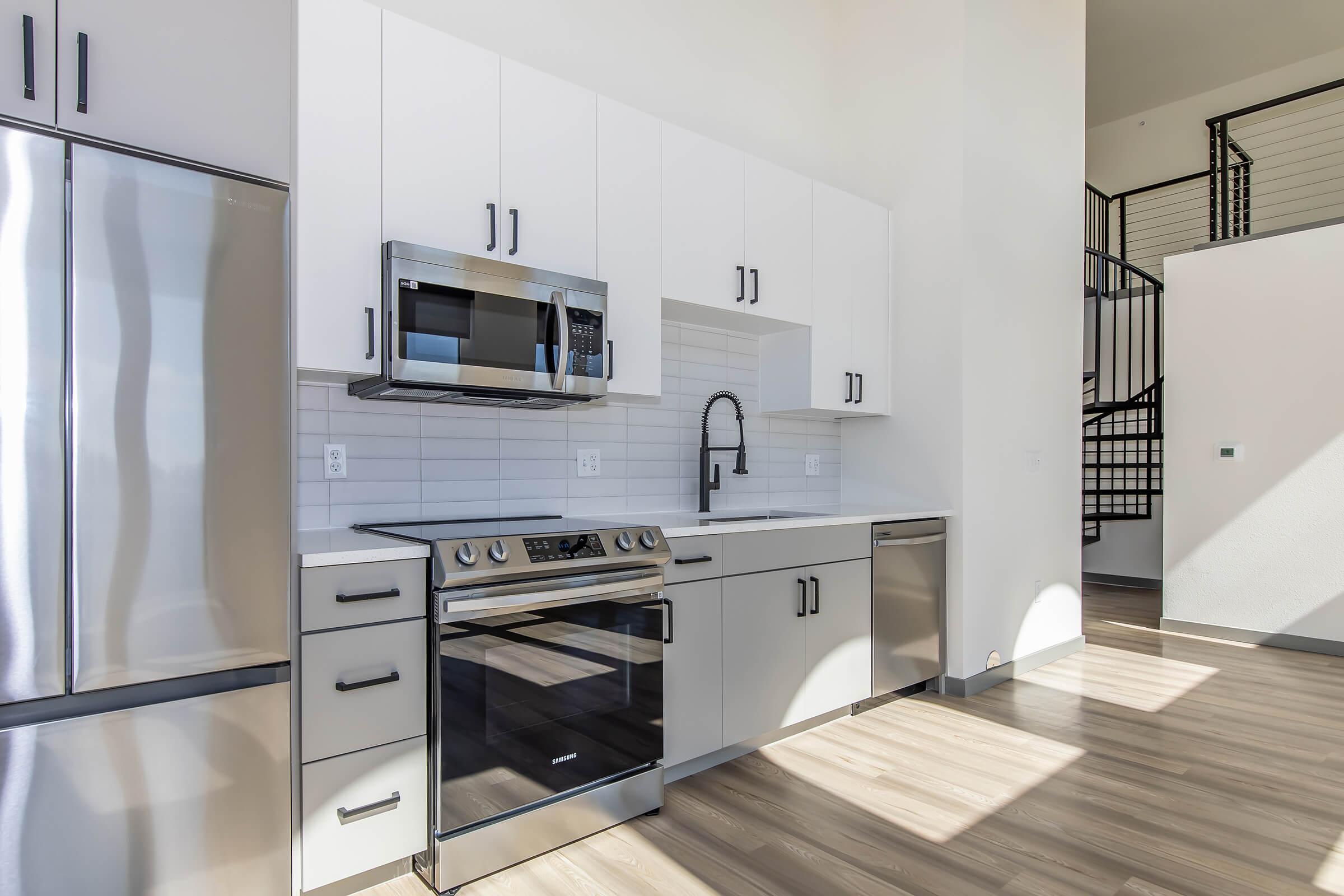 a kitchen with a stove and a sink