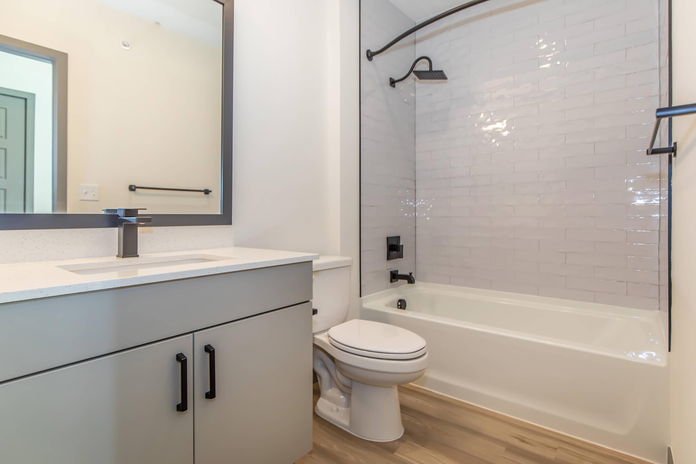 a room with a sink and a shower