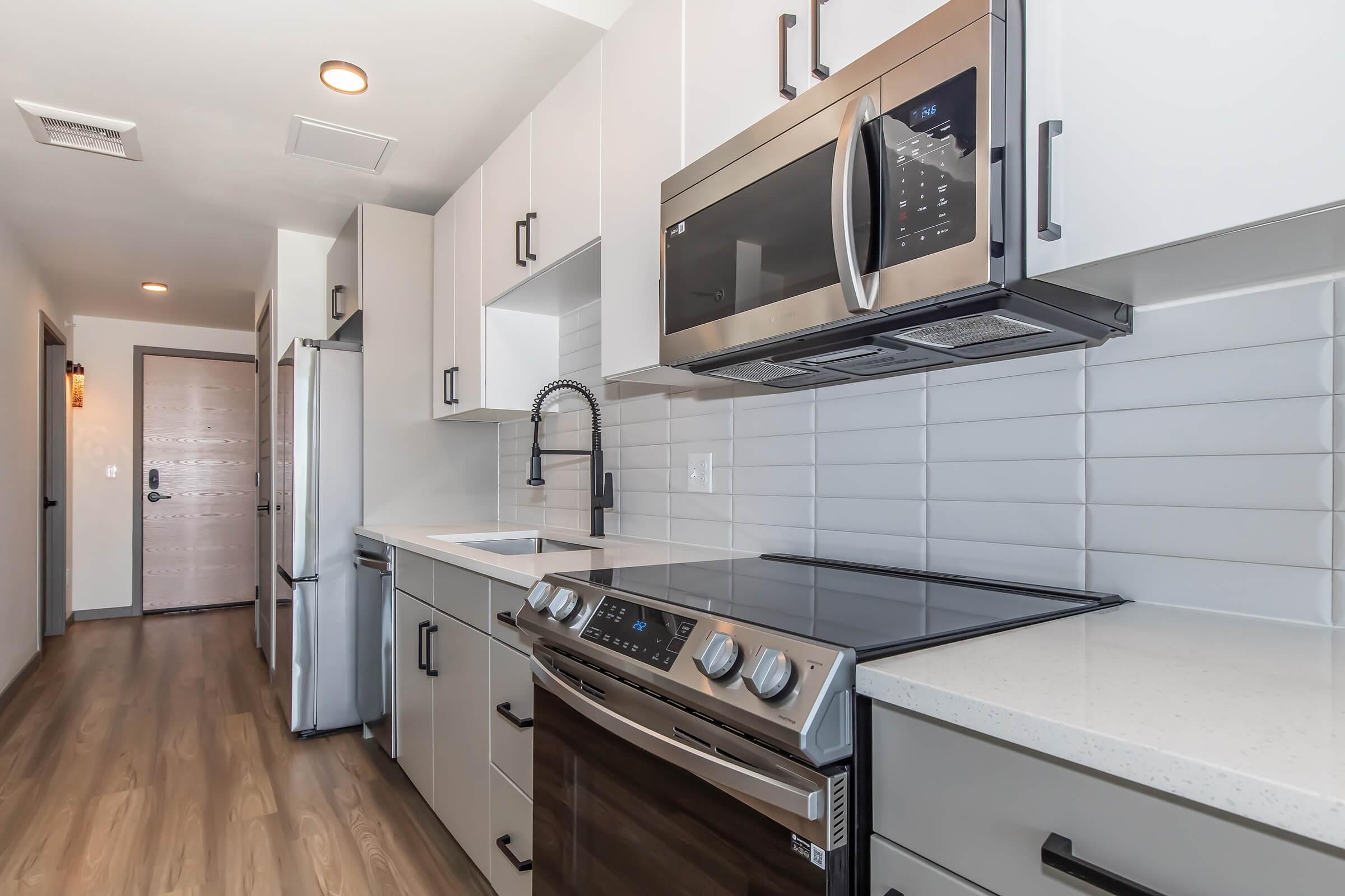 a kitchen with a stove and a sink