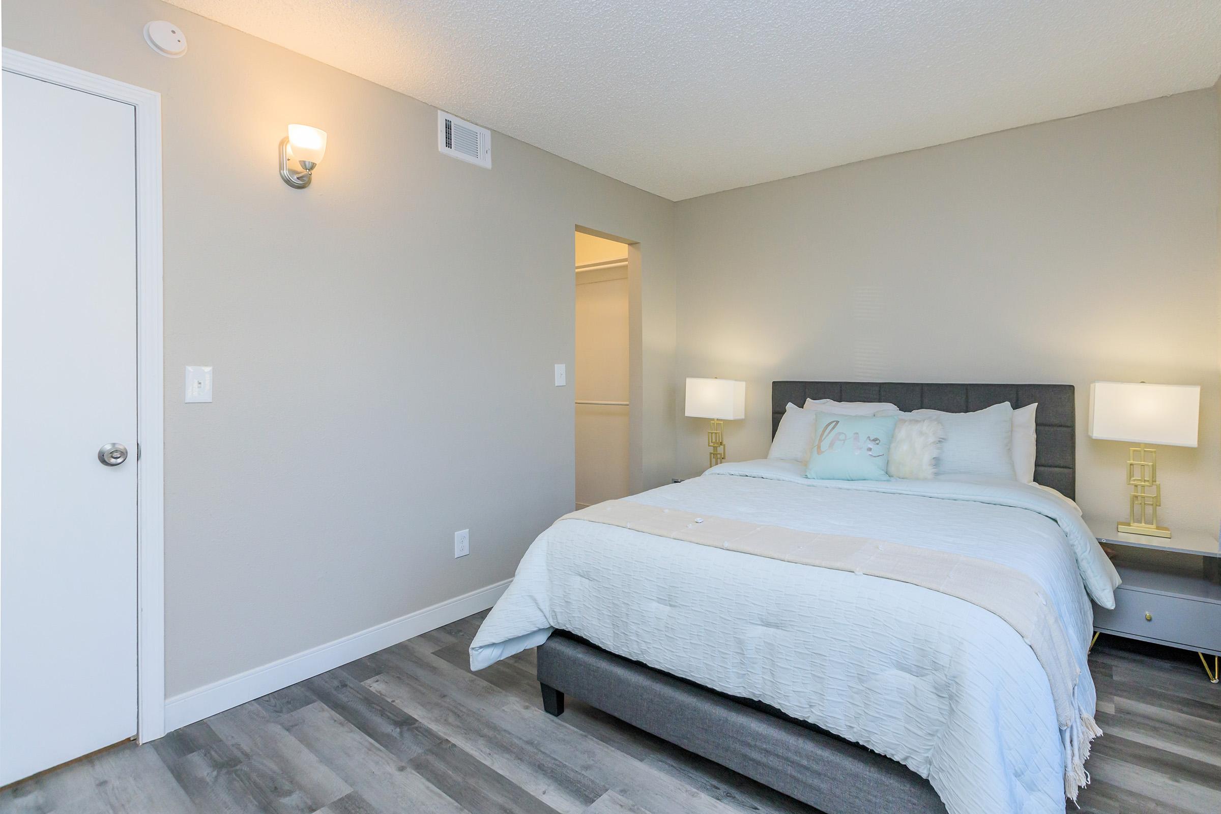 a bedroom with a large bed in a room