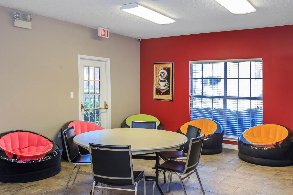 a large red chair in a room