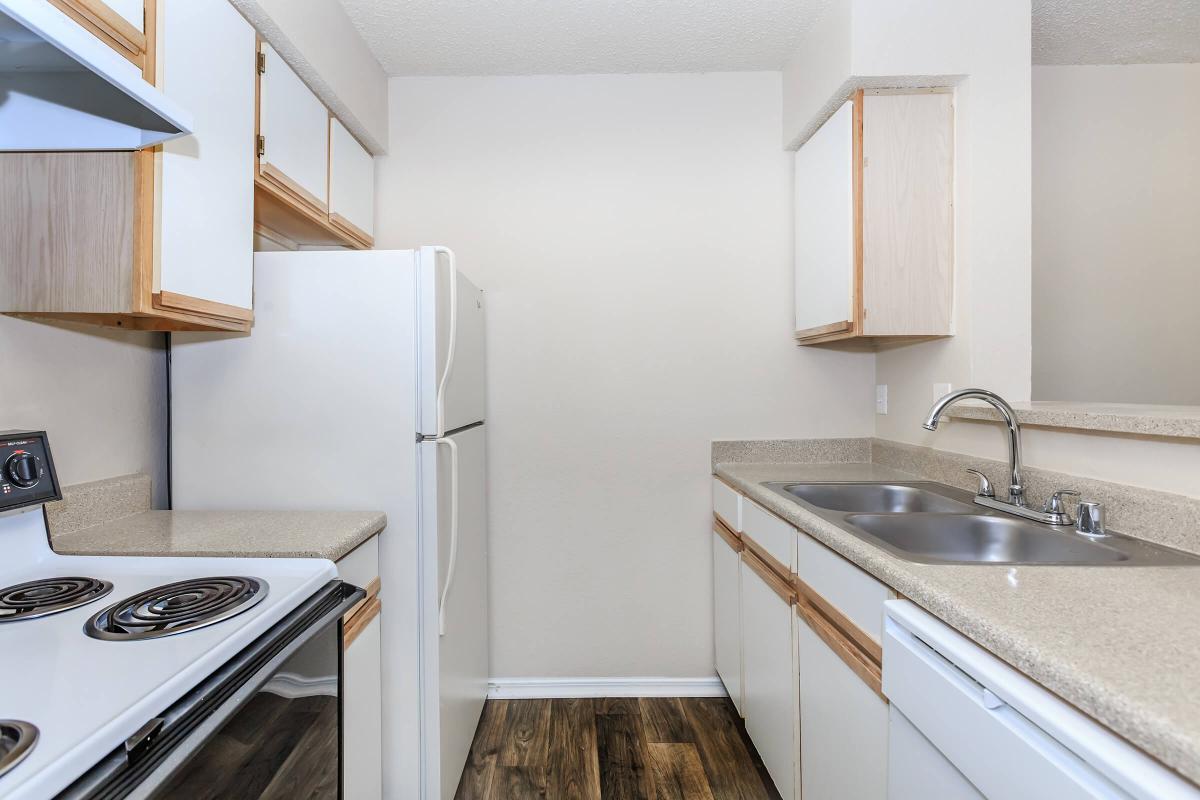 a kitchen with a stove and a sink