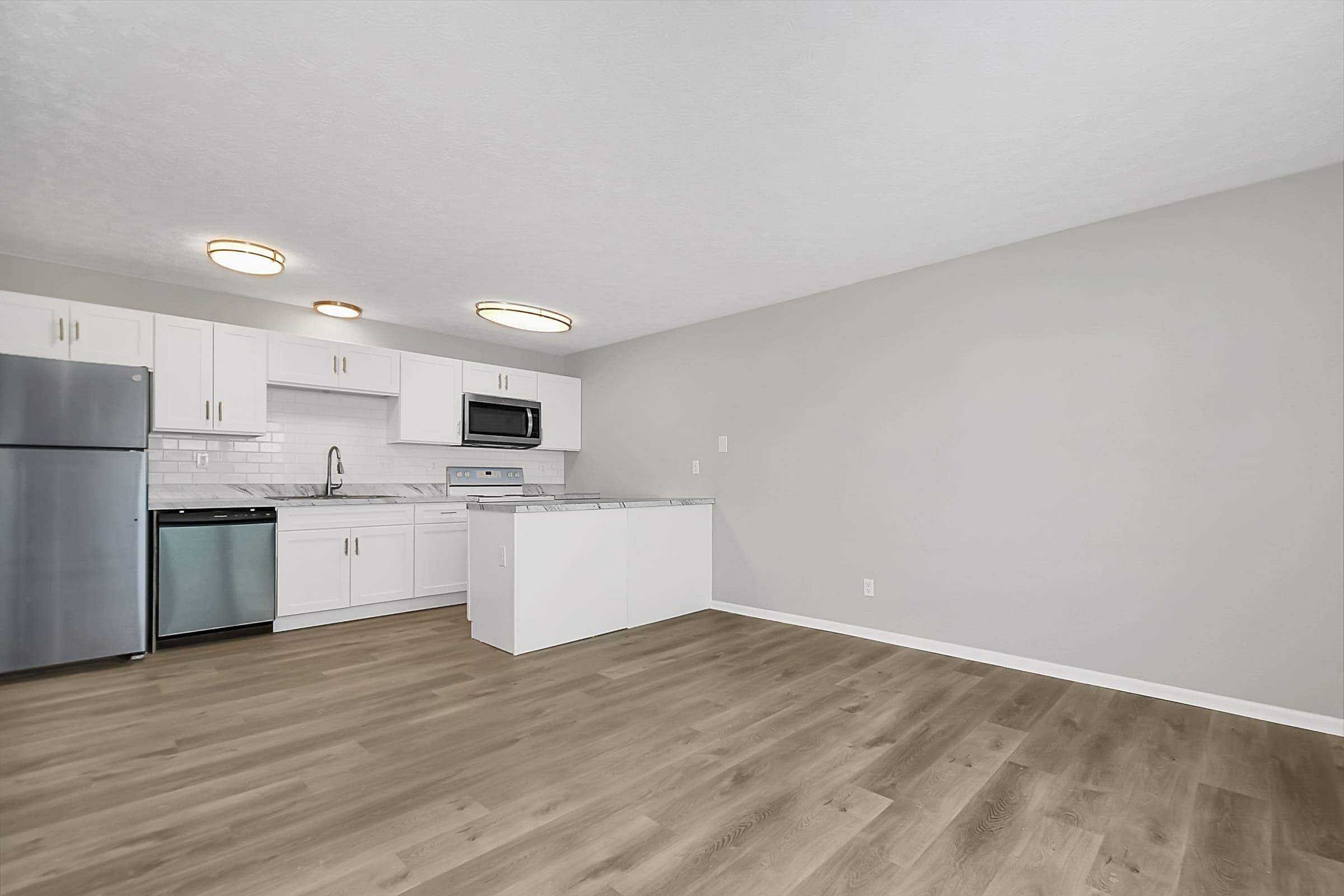 a kitchen with a wood floor