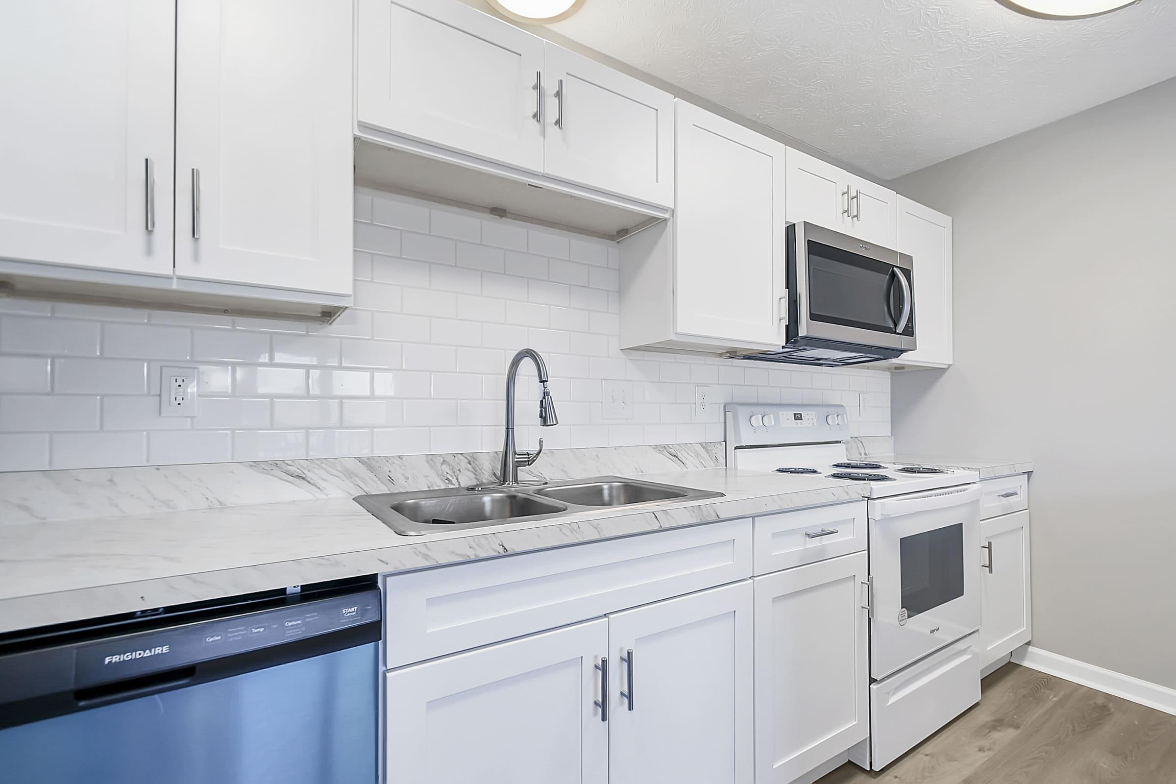 a kitchen with a stove and a microwave