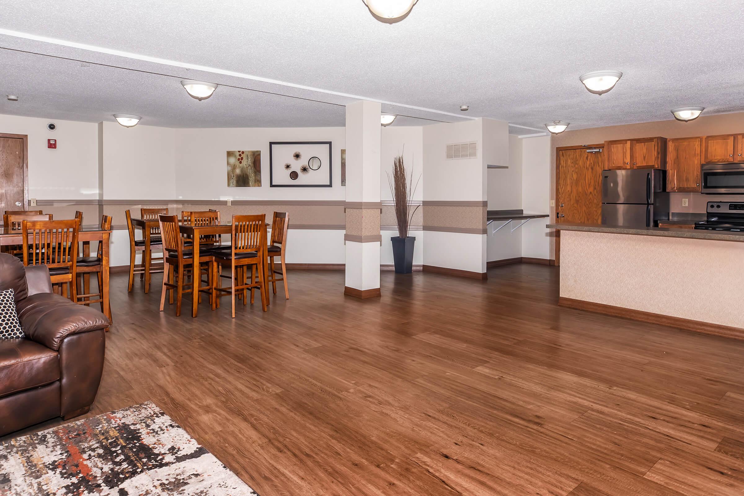 a living room filled with furniture and a flat screen tv