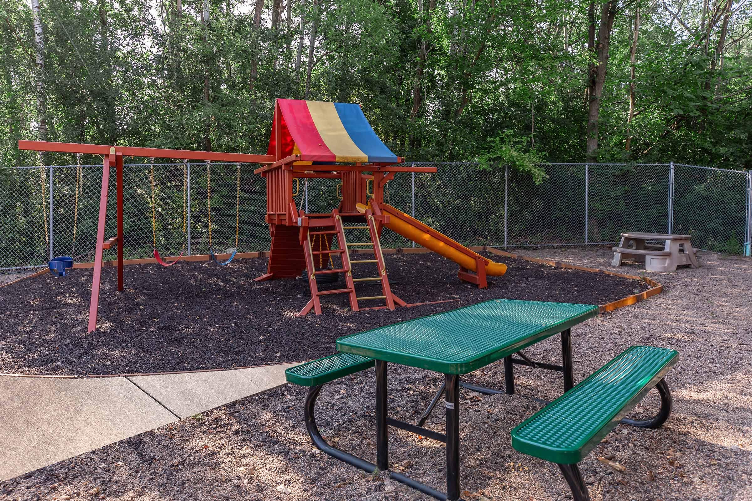 a group of lawn chairs sitting on top of a picnic table