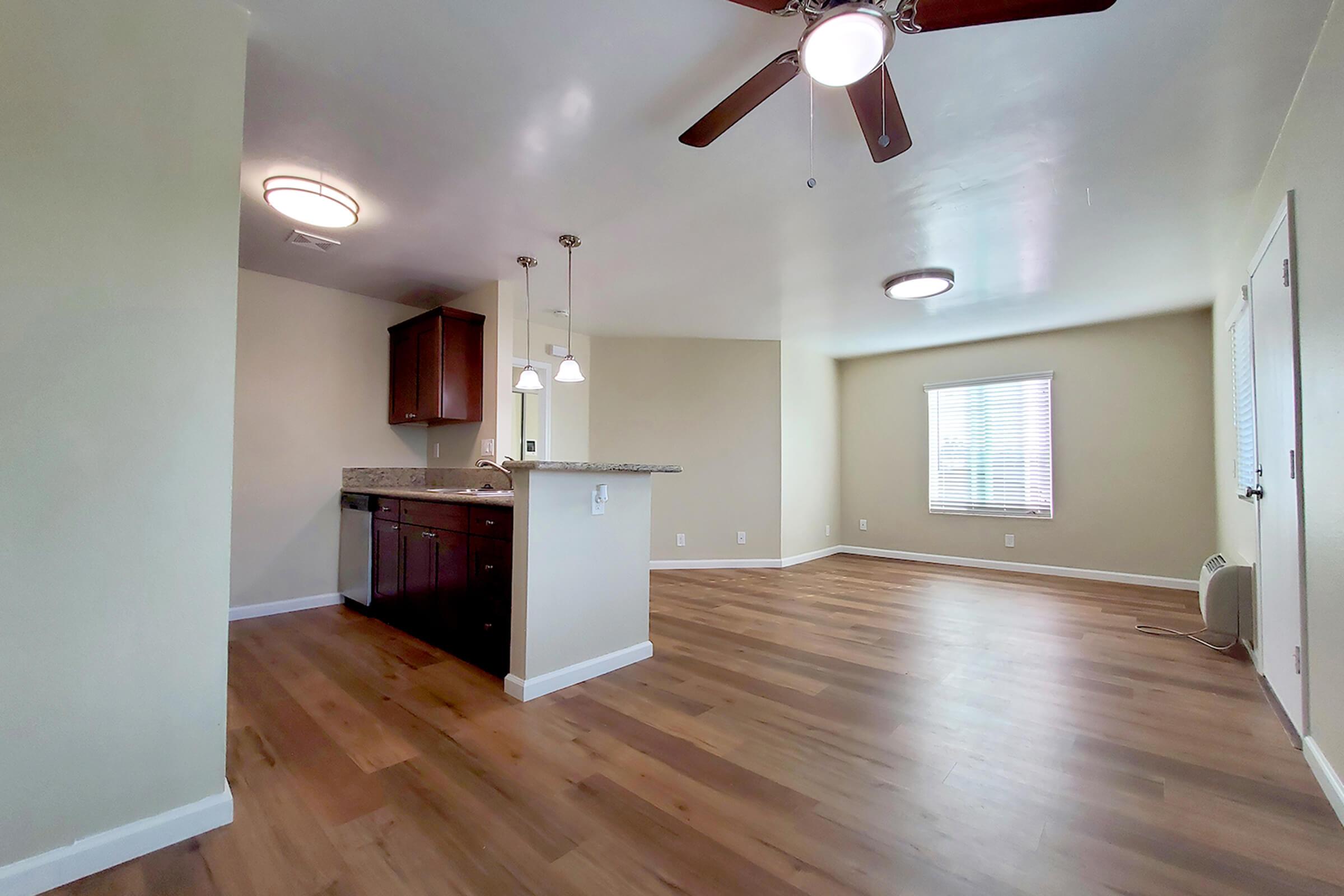 a large empty room with a wood floor