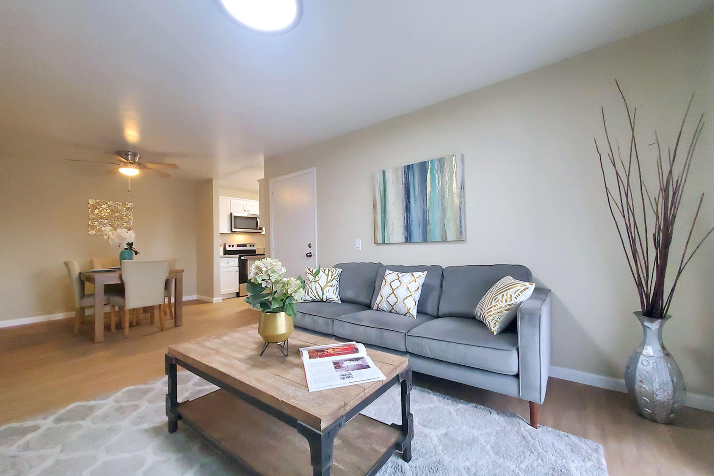 a living room filled with furniture and a flat screen tv