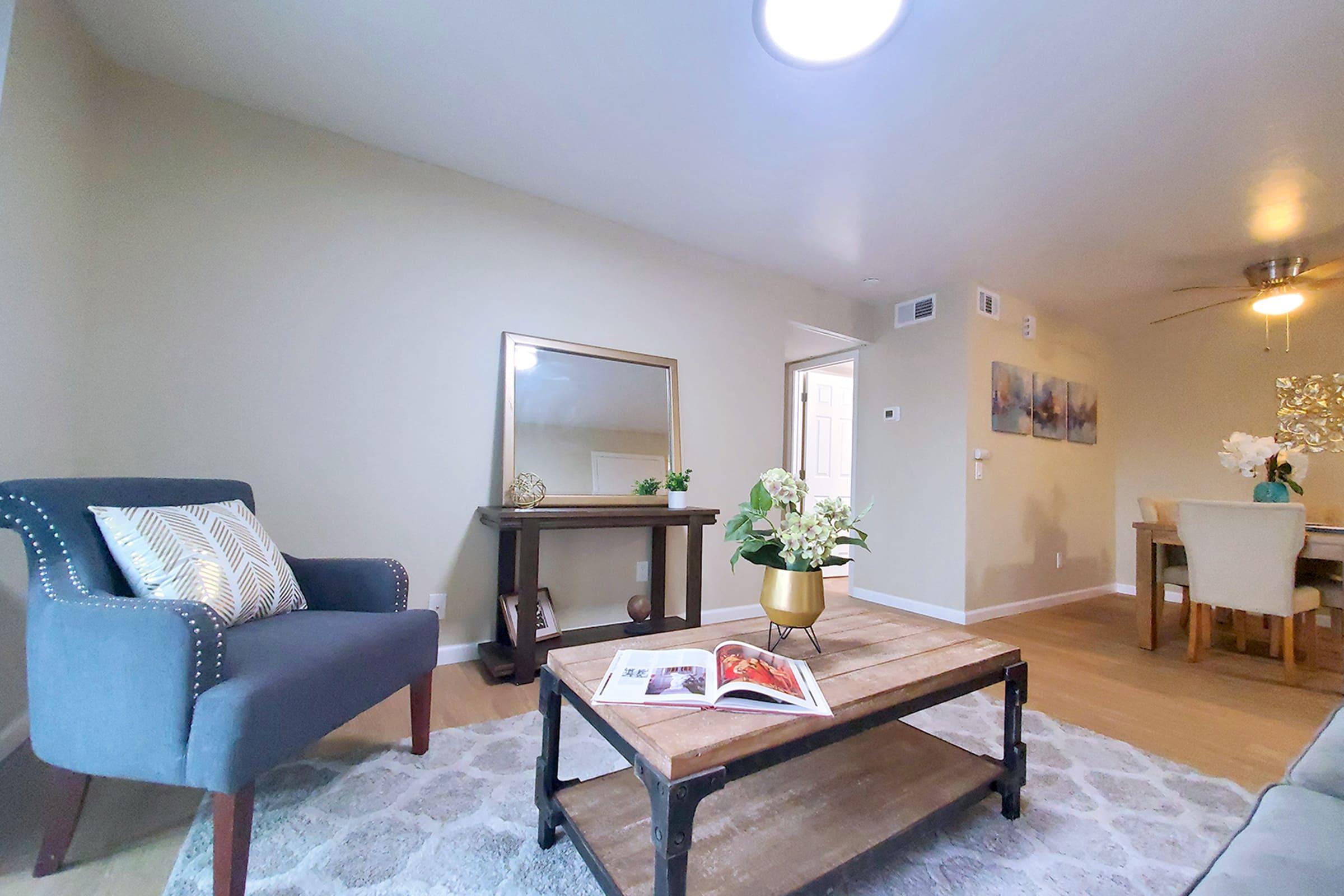 a living room filled with furniture and a fireplace