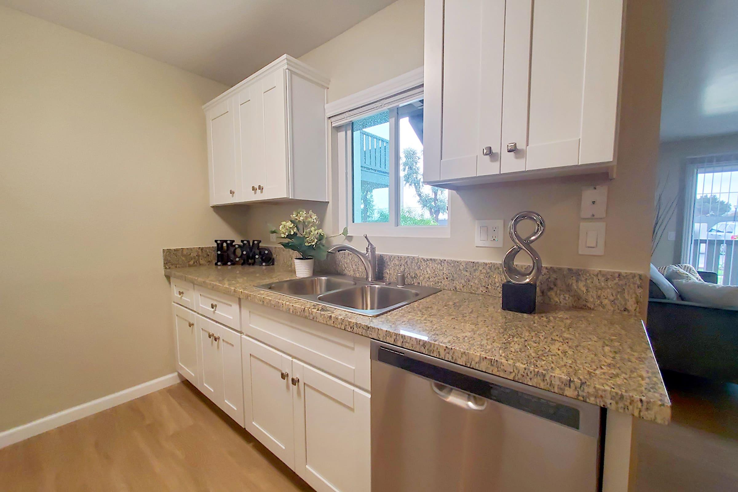 a kitchen with a sink and a window