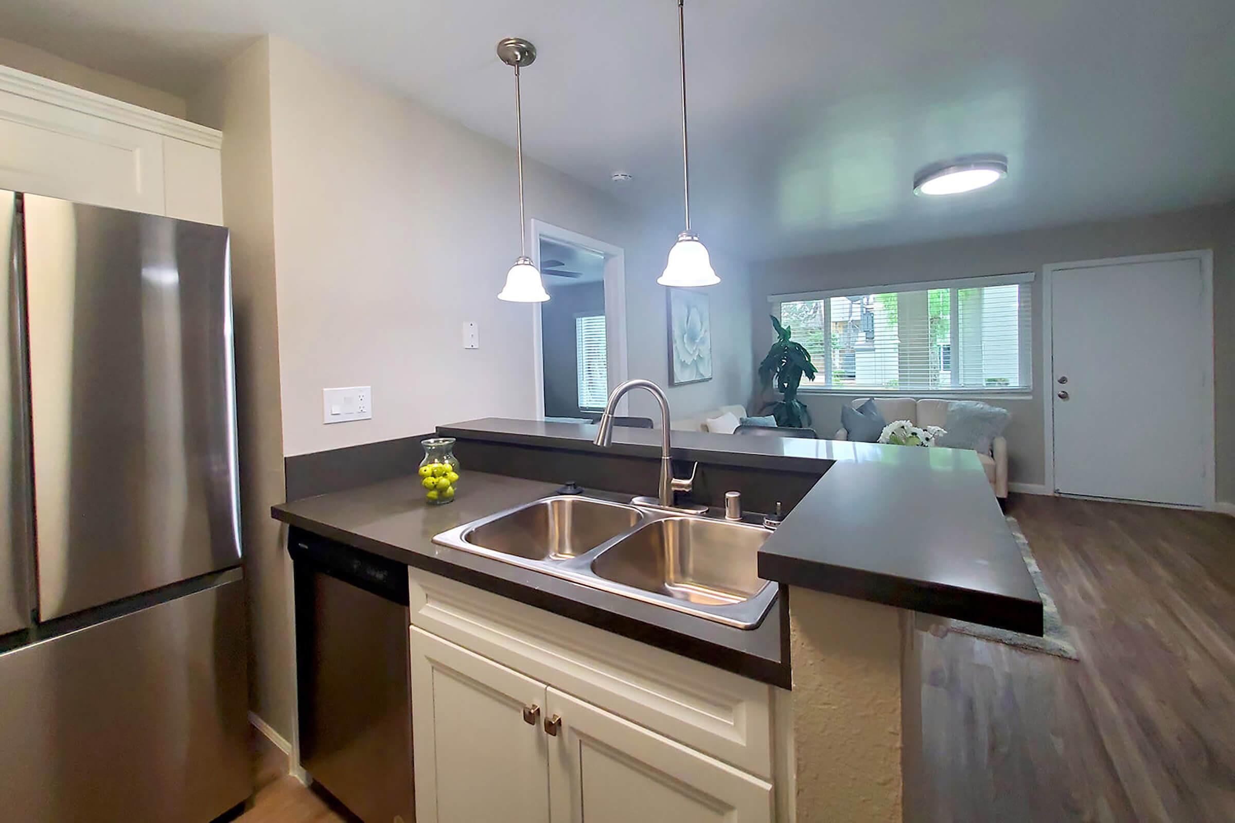 a modern kitchen with stainless steel appliances