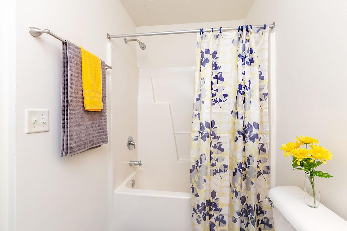 a yellow and white shower curtain