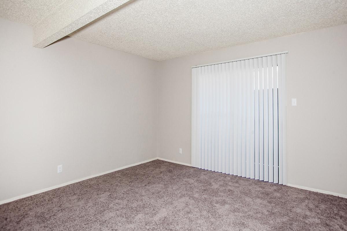 a bedroom with a bed in a room