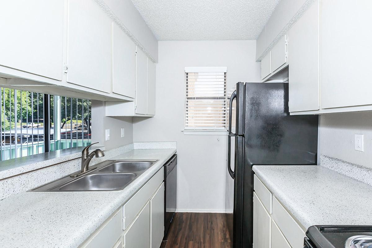 a large kitchen with stainless steel appliances