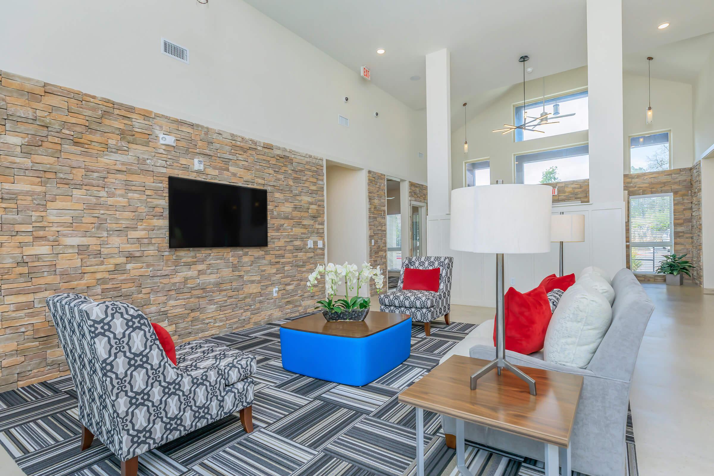 a living room filled with furniture and a fireplace