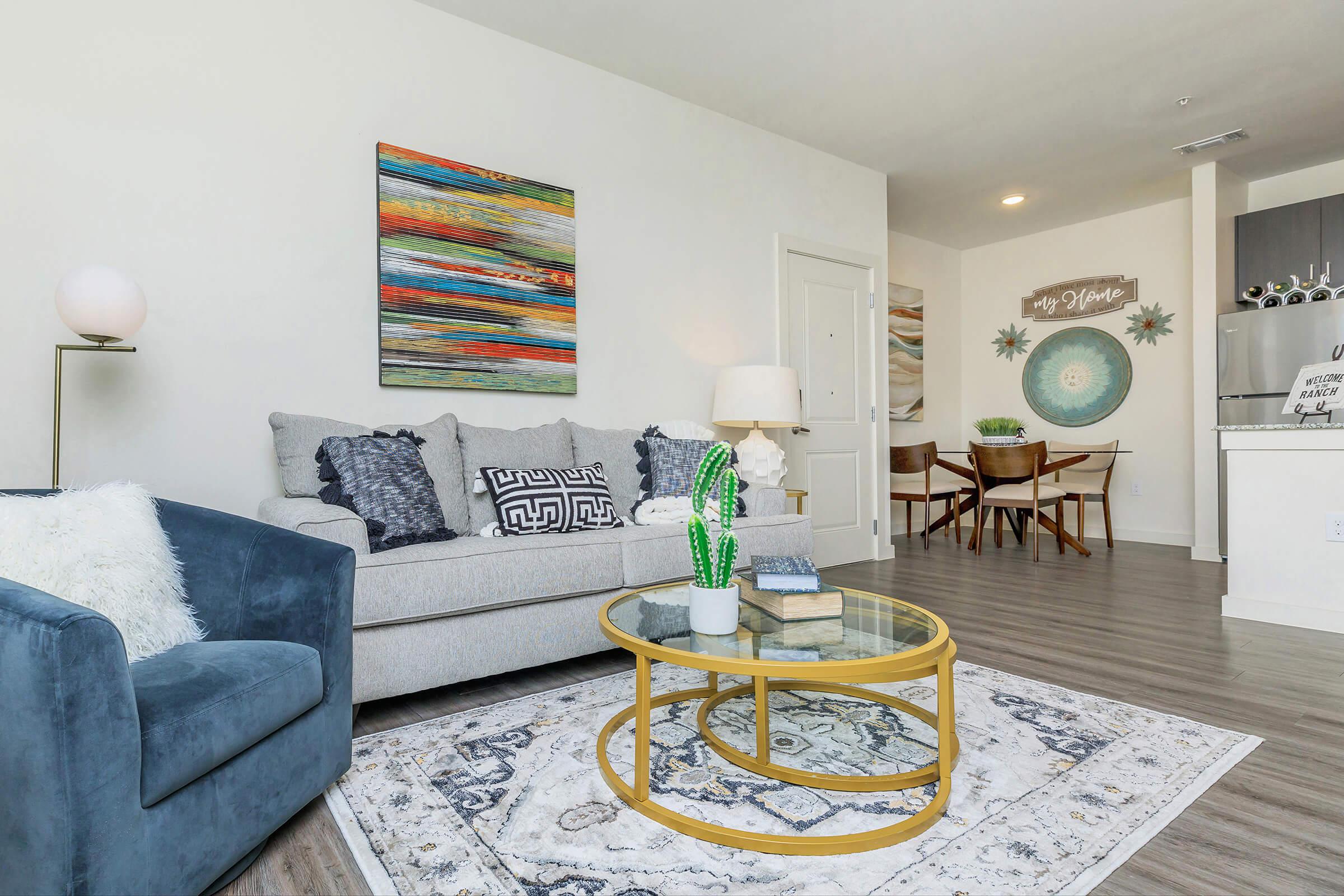 a living room filled with furniture and a rug