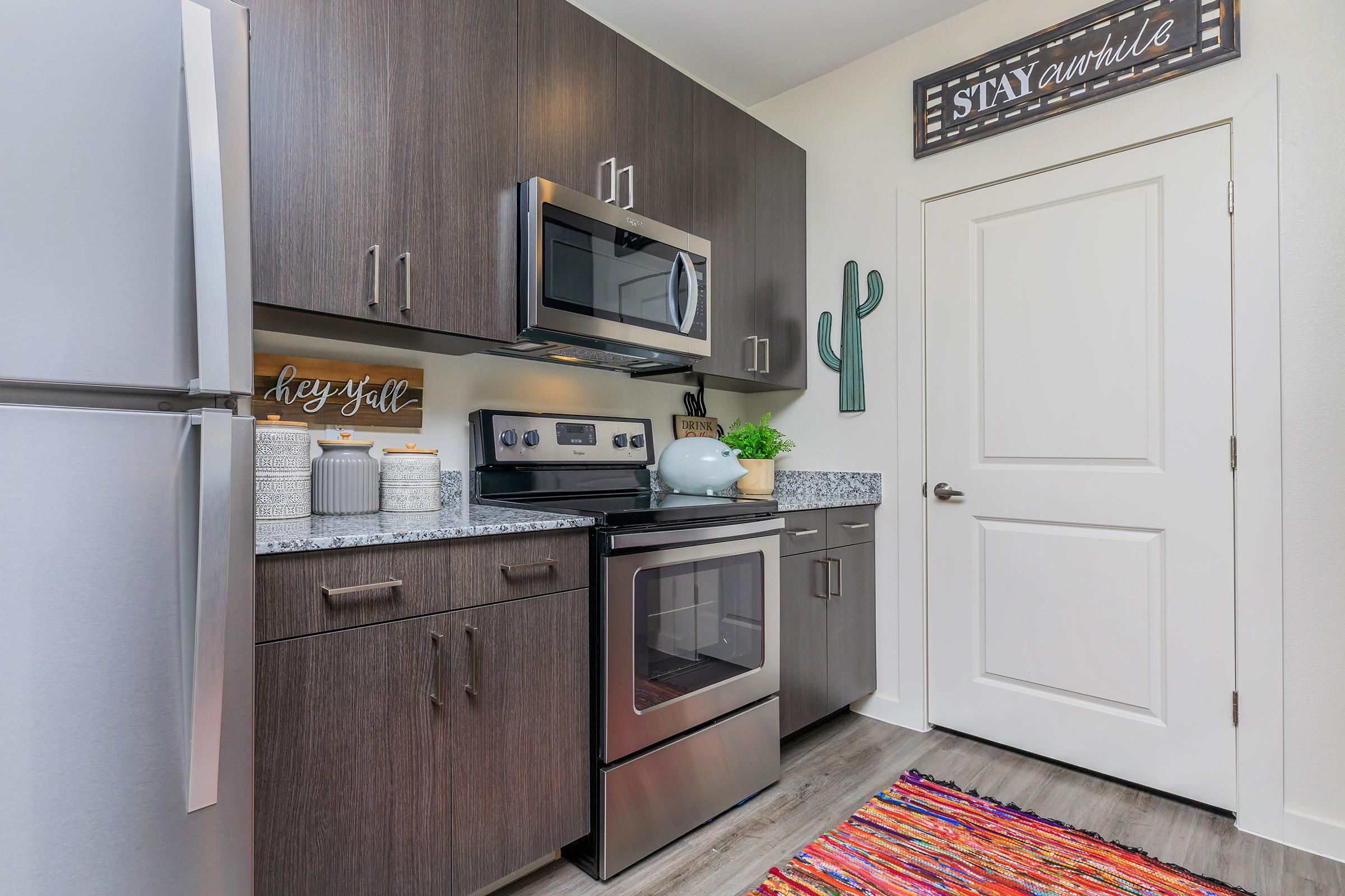 a kitchen with a stove top oven sitting inside of a refrigerator