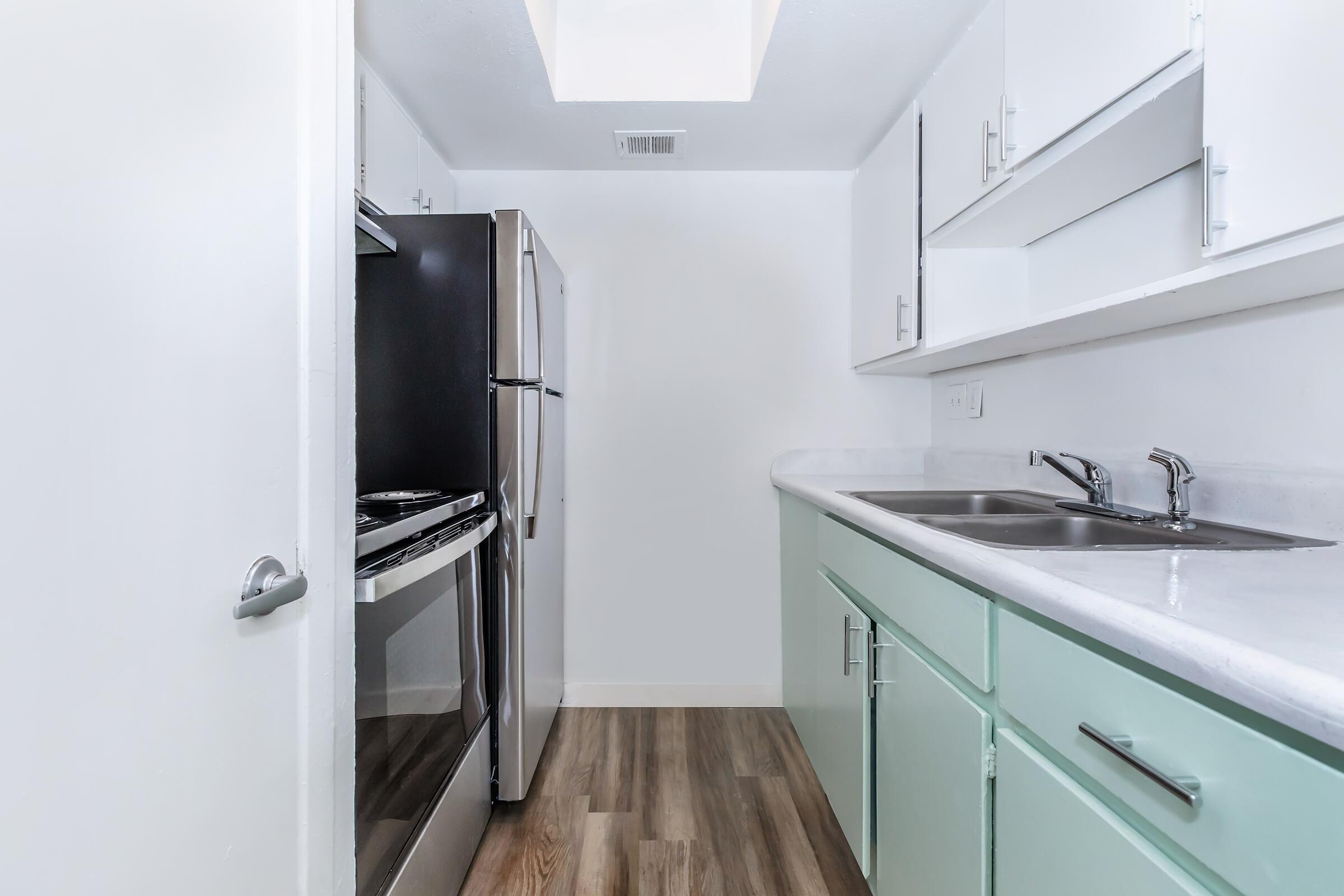 a kitchen with a sink and a shower