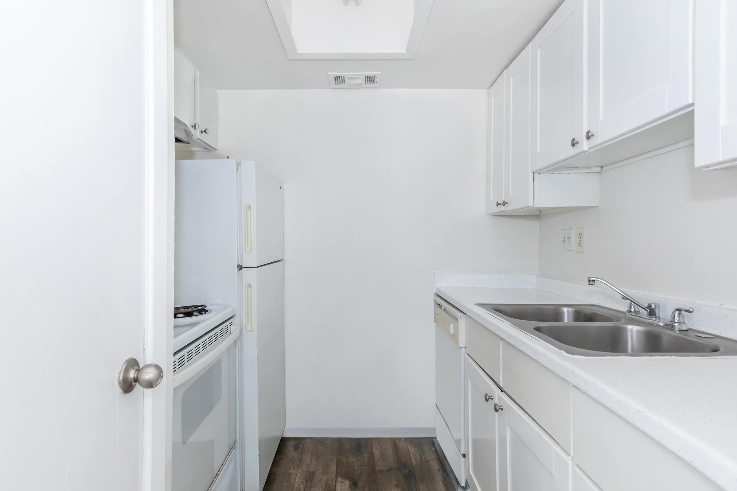 a kitchen with a sink and a shower