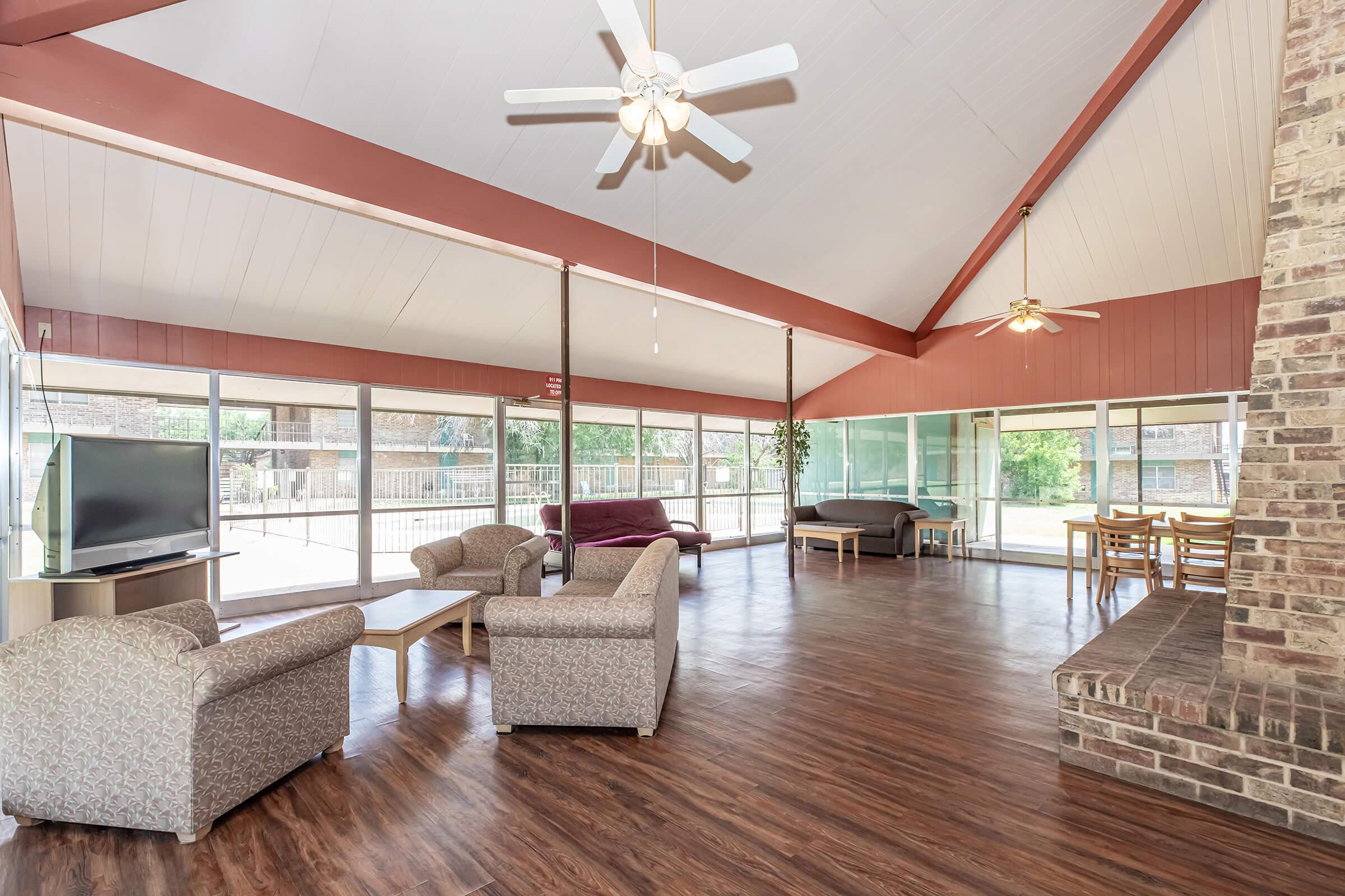 a room filled with furniture and a large window