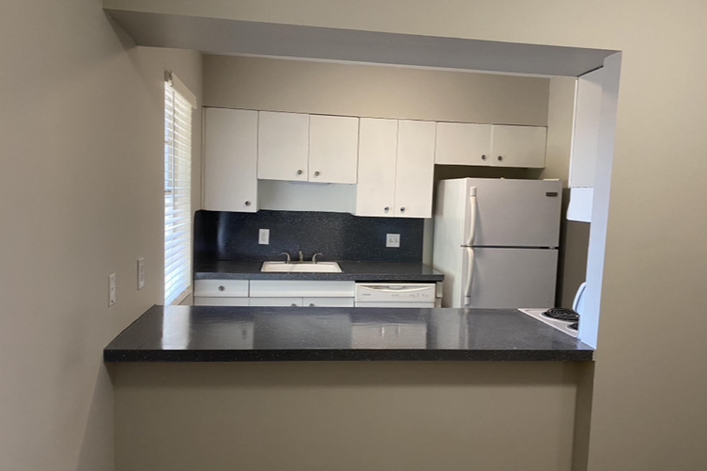 a kitchen with a sink and a microwave