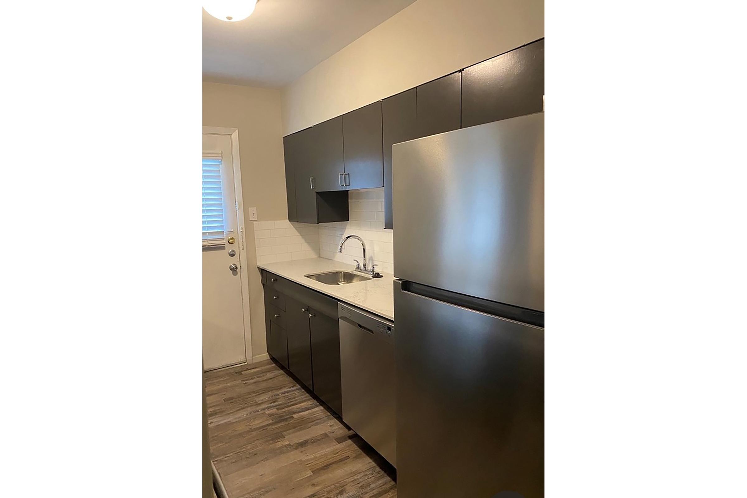 a stainless steel refrigerator in a kitchen