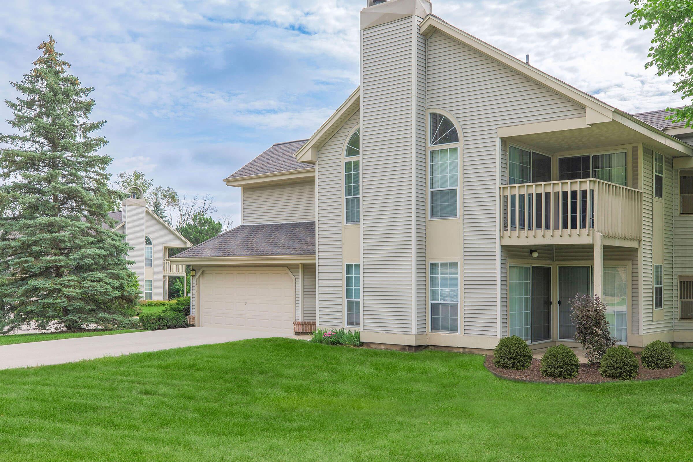 a large lawn in front of a house