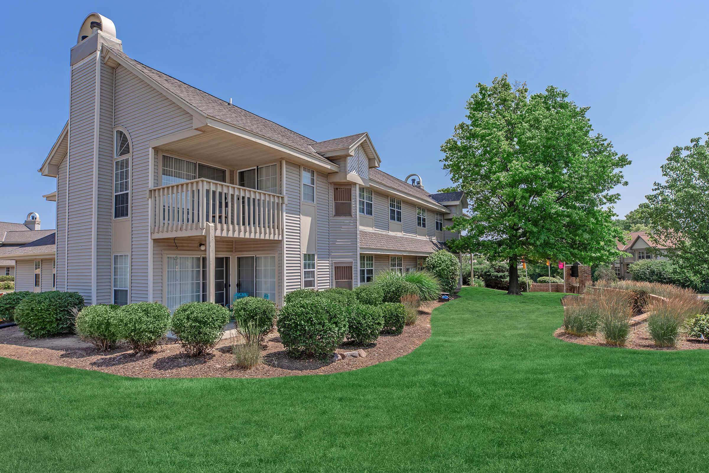 a large lawn in front of a house