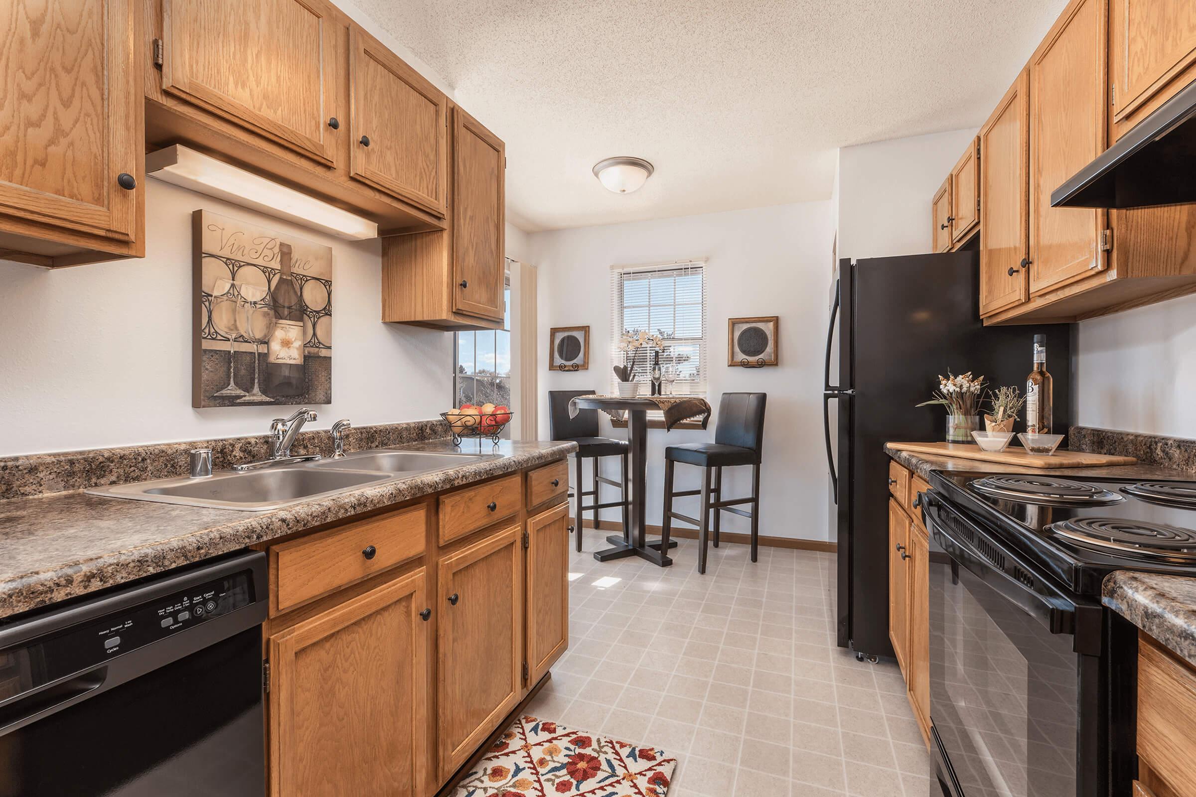 a room filled with furniture and a stove in a kitchen