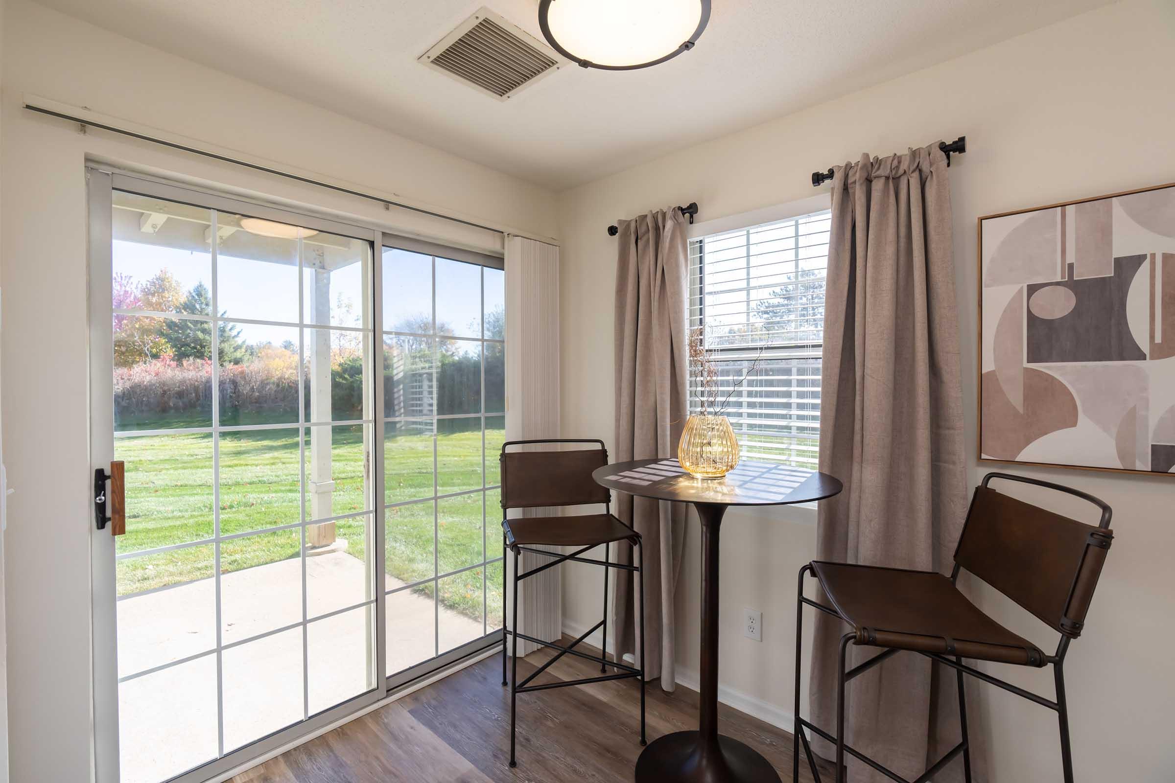 a room filled with furniture and a large window