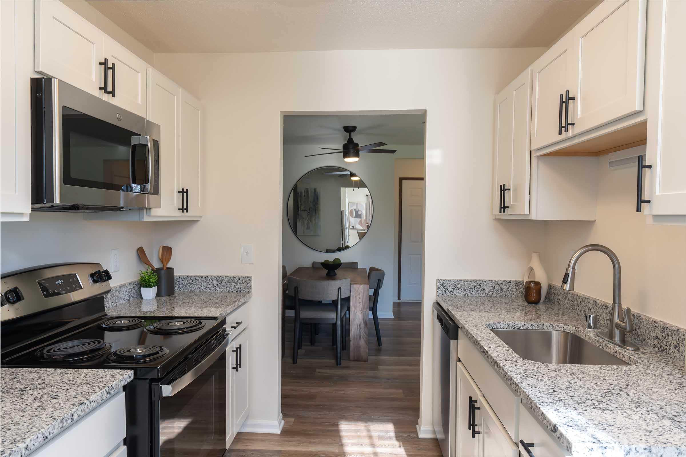 a kitchen with a stove and a sink