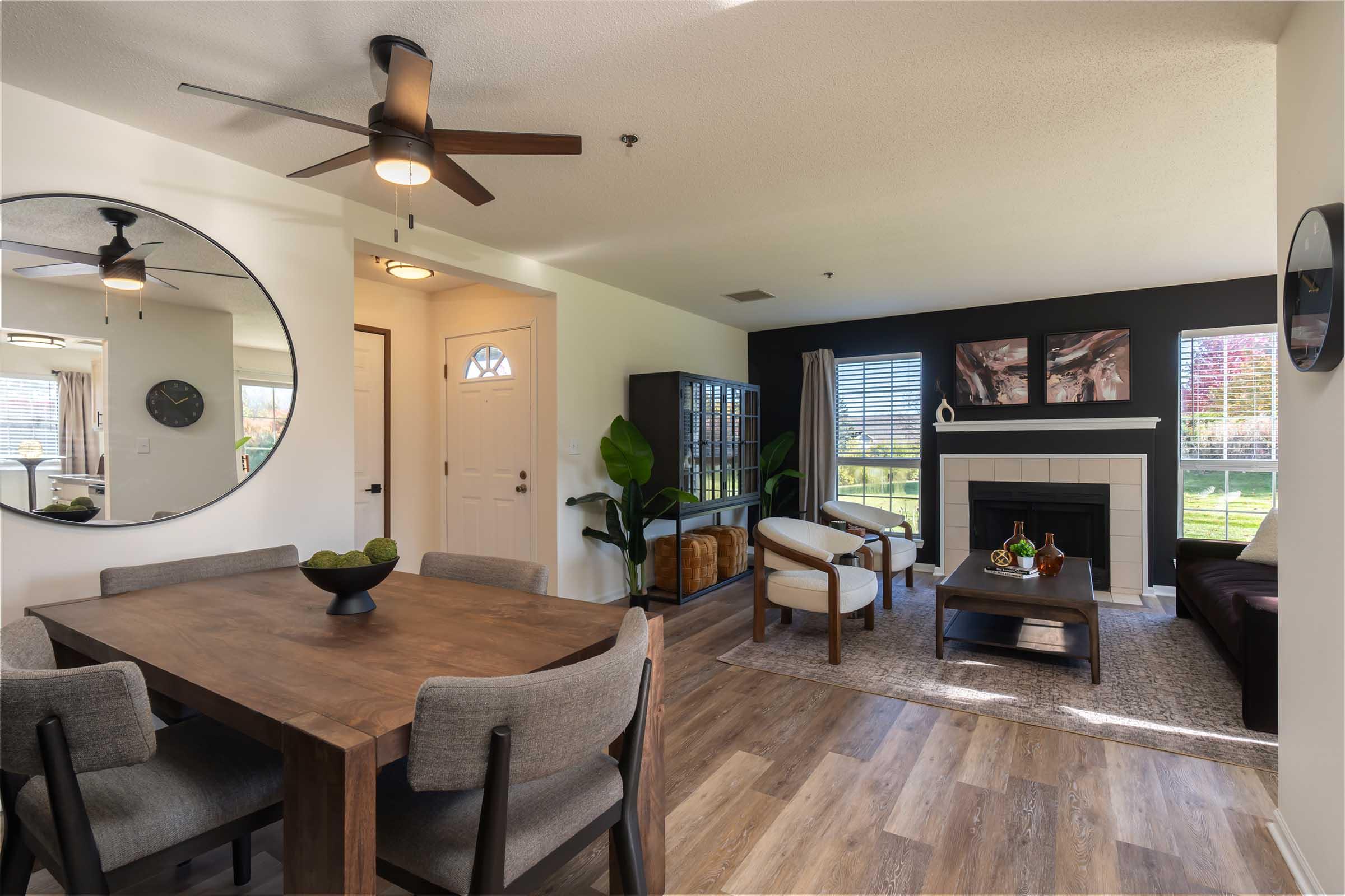 a living room filled with furniture and a fireplace