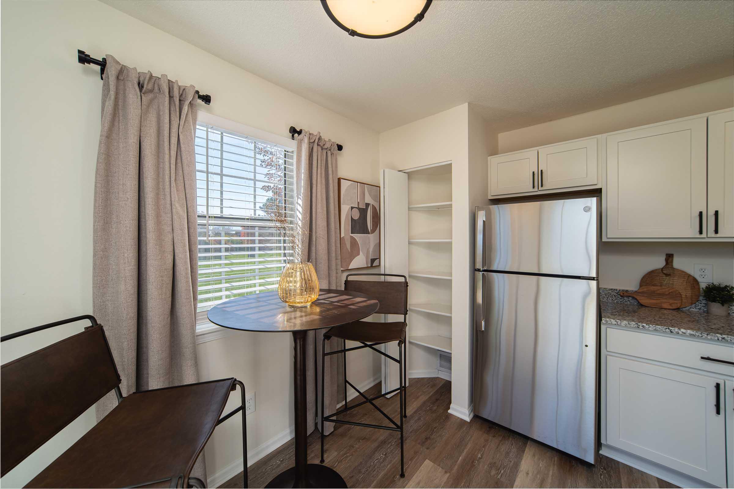 a kitchen with a dining room table