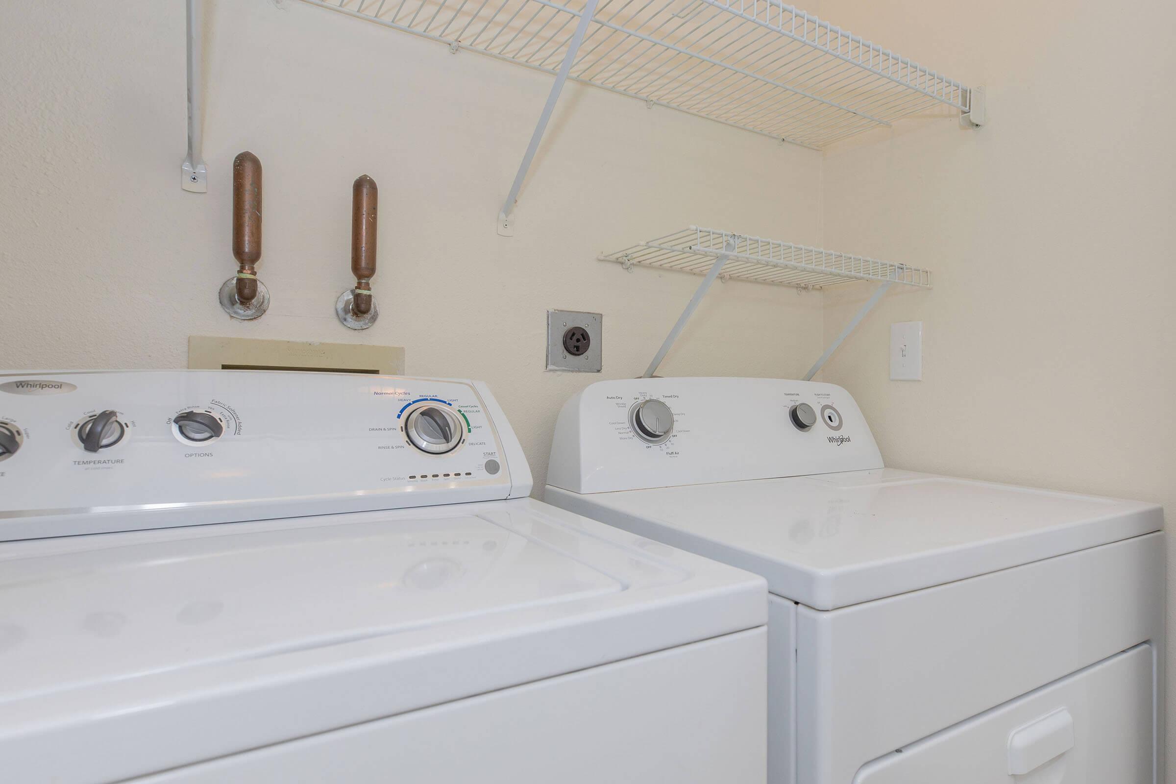 a stove top oven sitting next to a sink