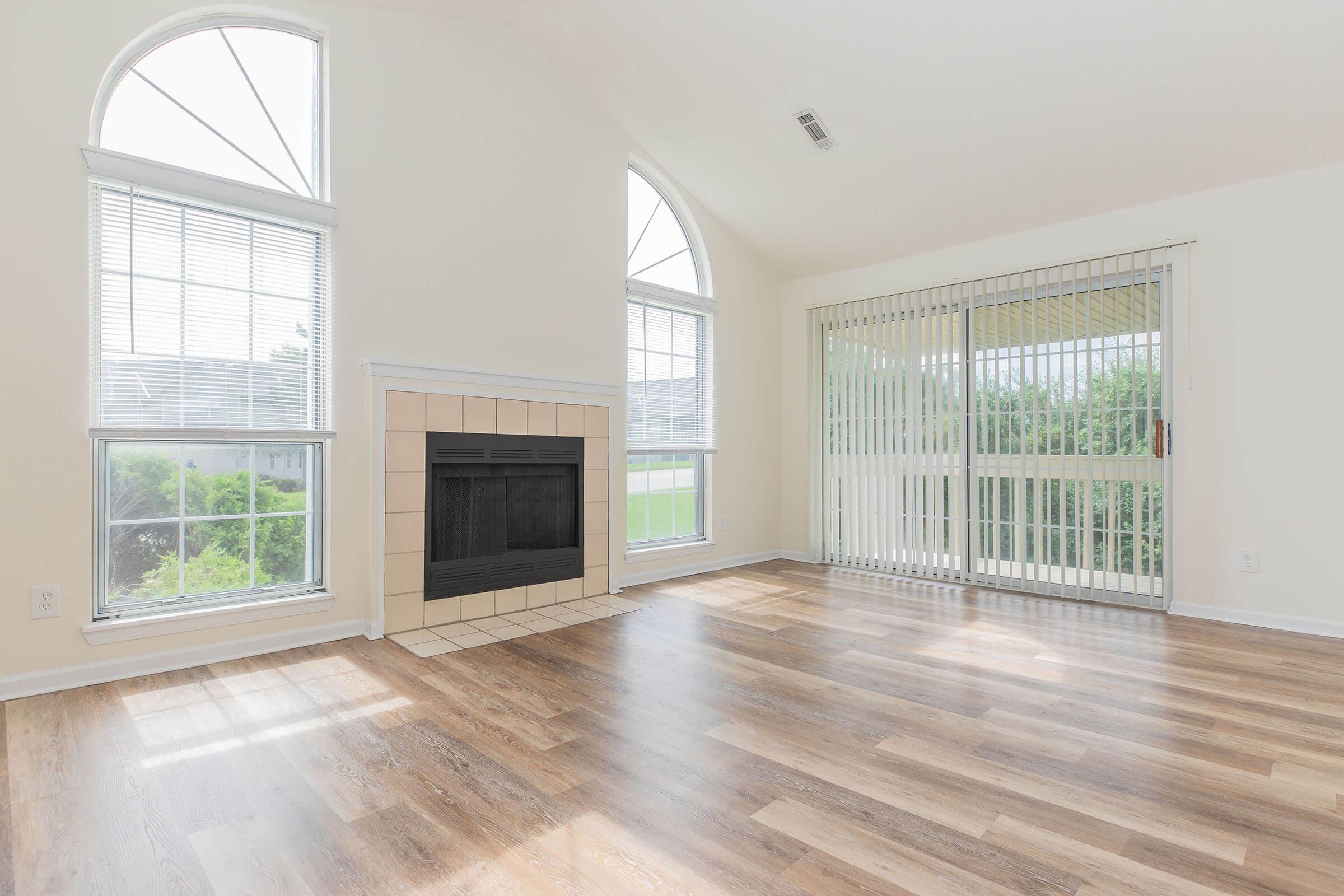 a view of a living room with a large window