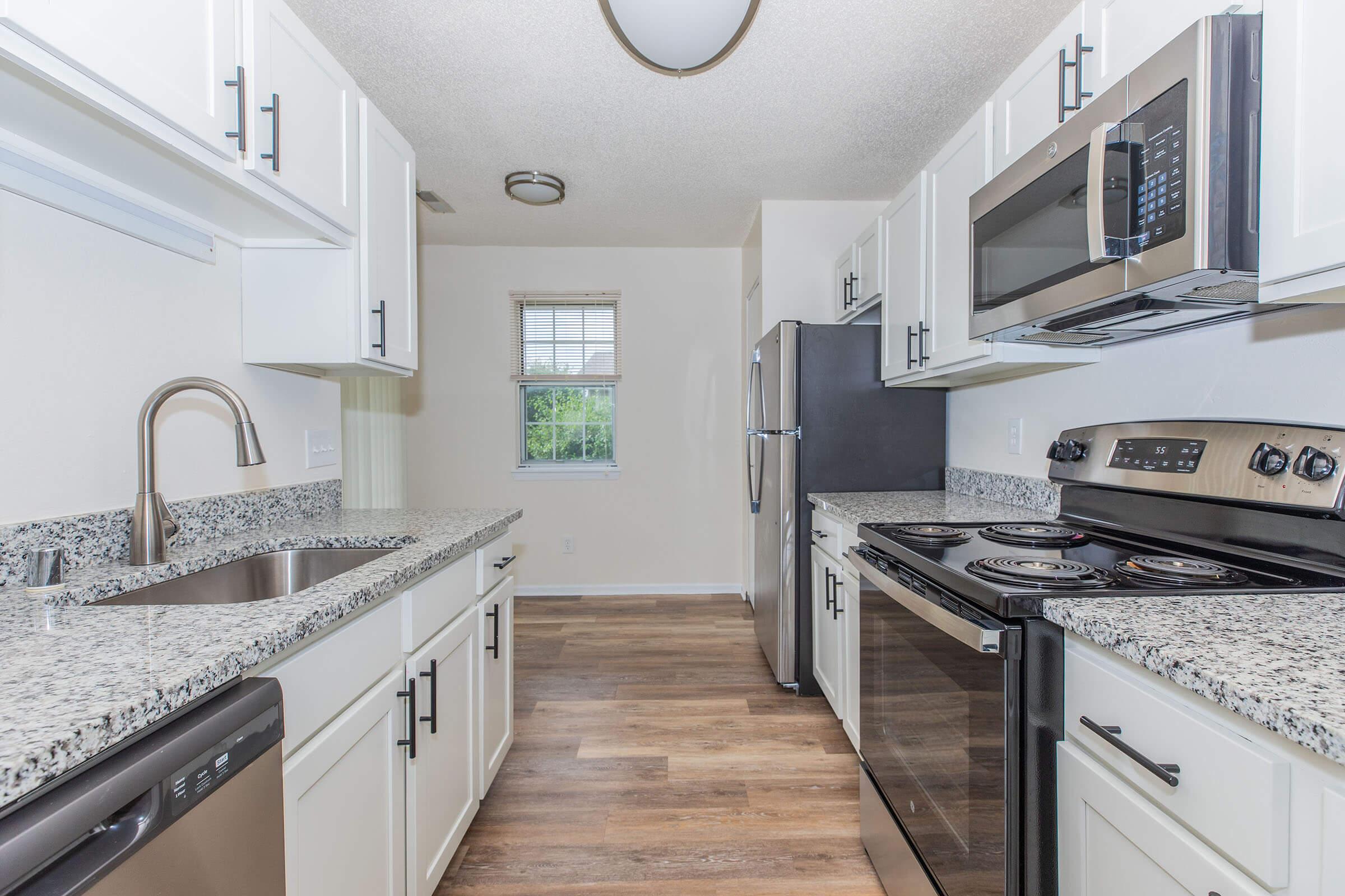 a kitchen with a stove top oven