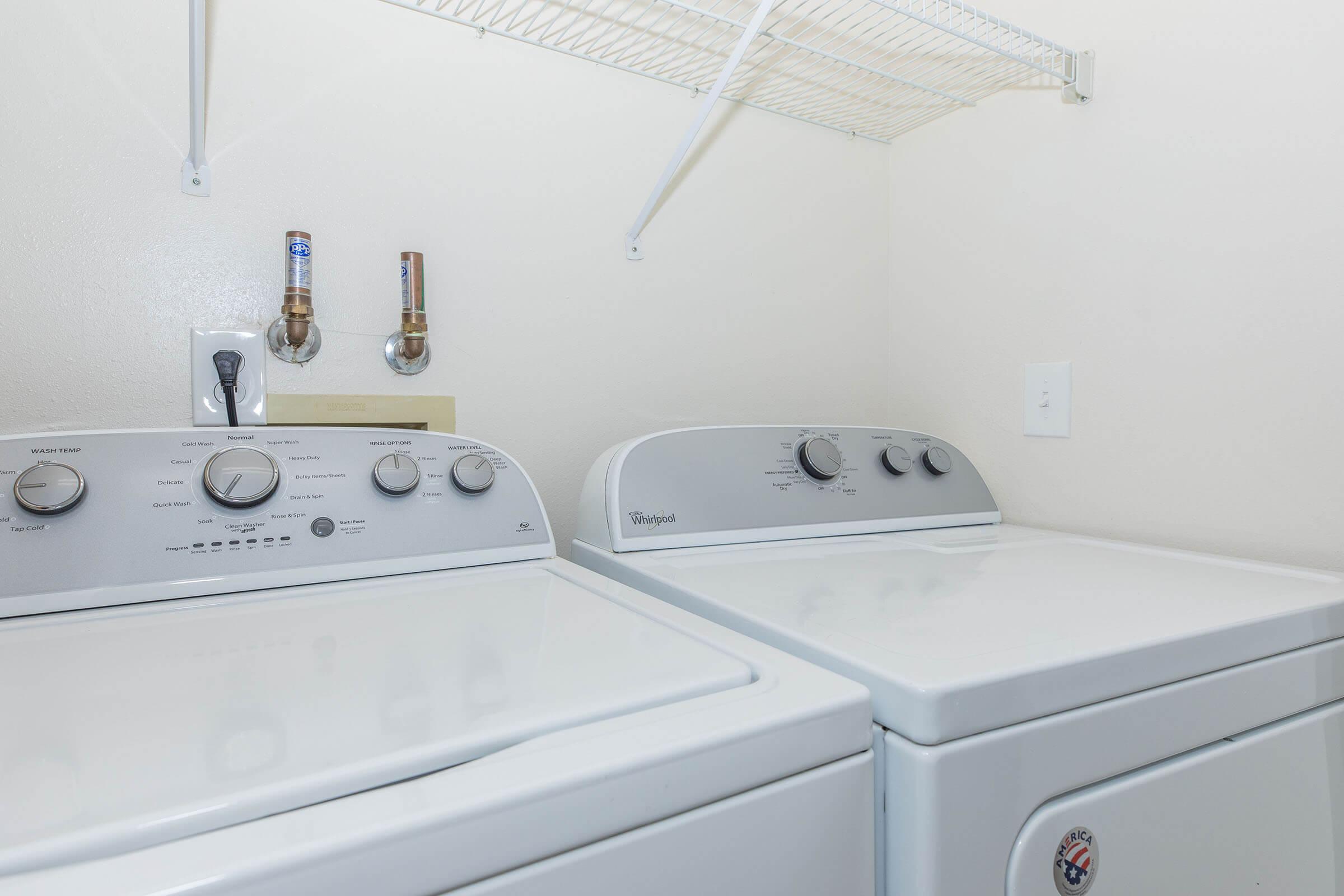 a stove top oven sitting inside of a kitchen