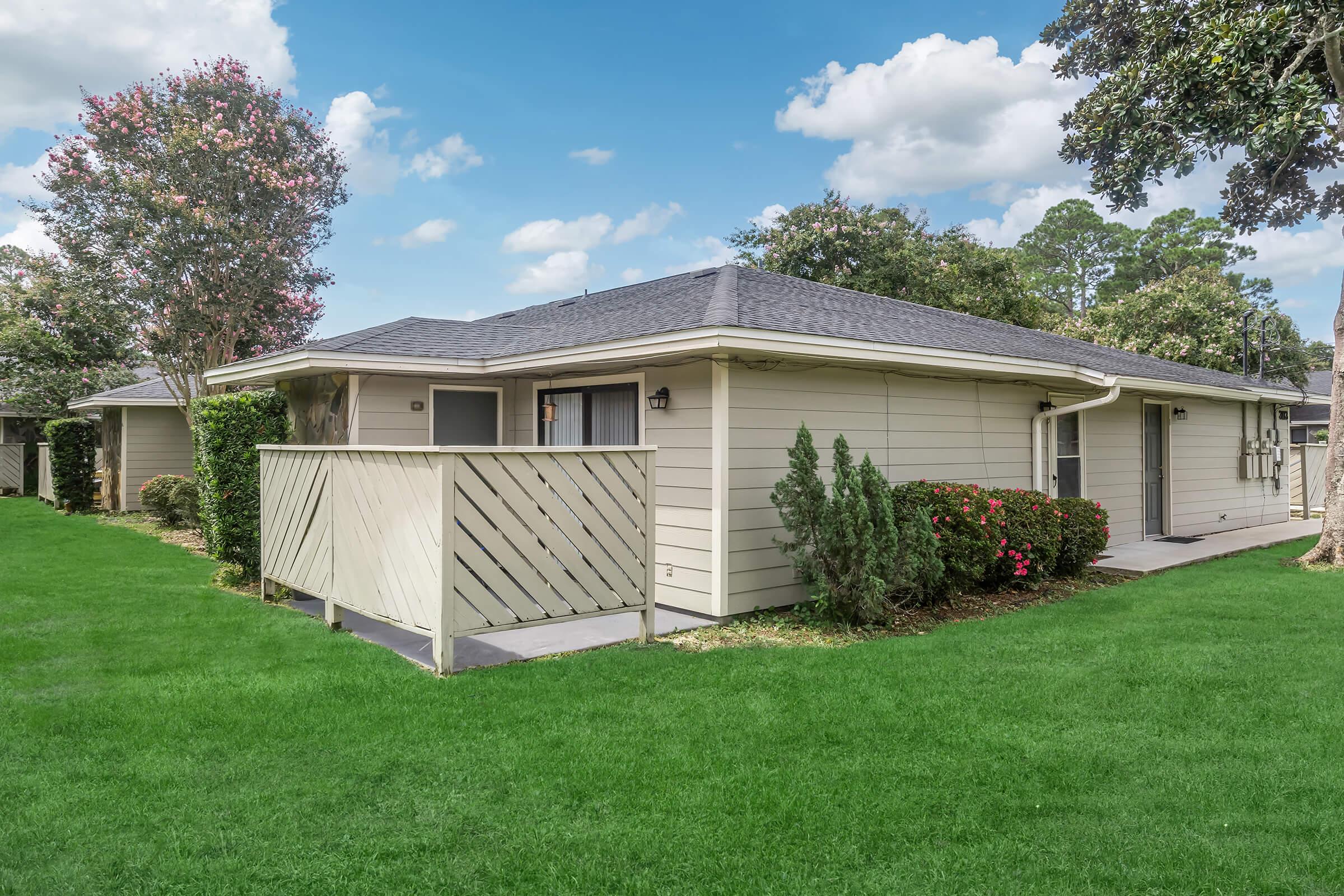 a large lawn in front of a house