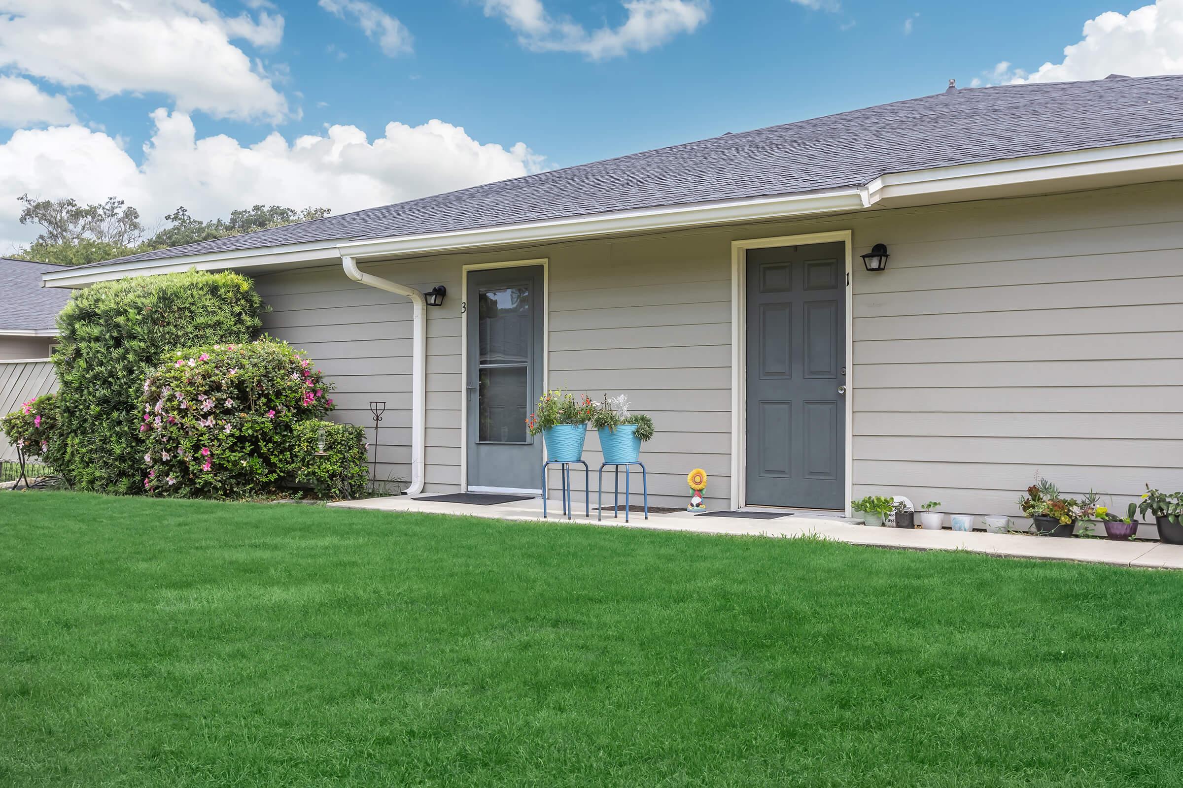 a large lawn in front of a house